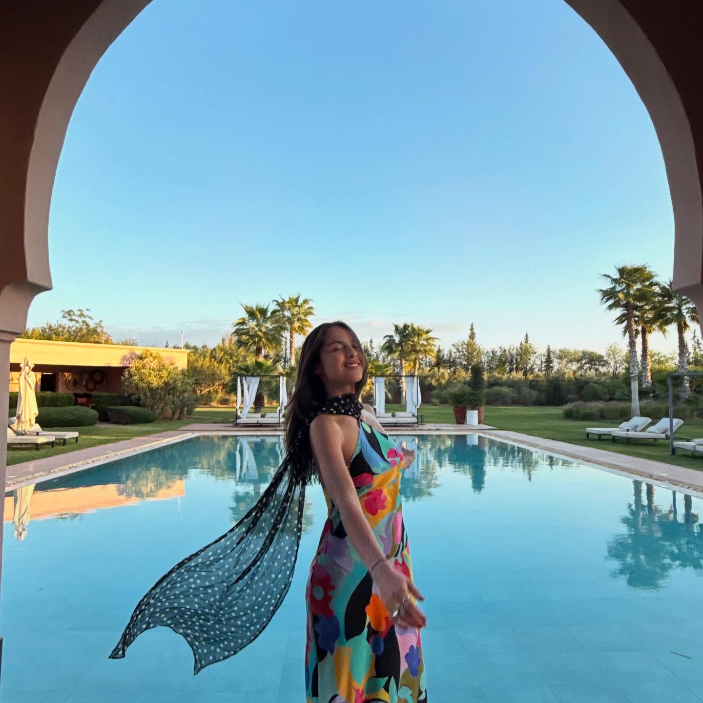 Olivia Rodrigo wears a floral and polka dot dress by Rixo