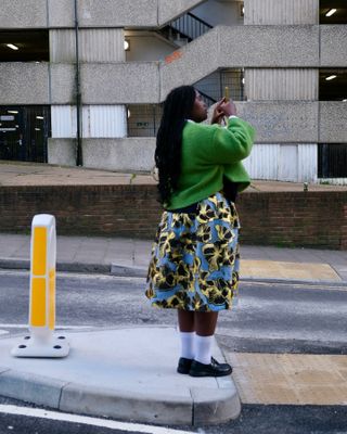 Influencer wears white socks with black shoes.