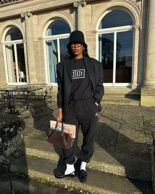 Influencer wears white socks with black shoes.