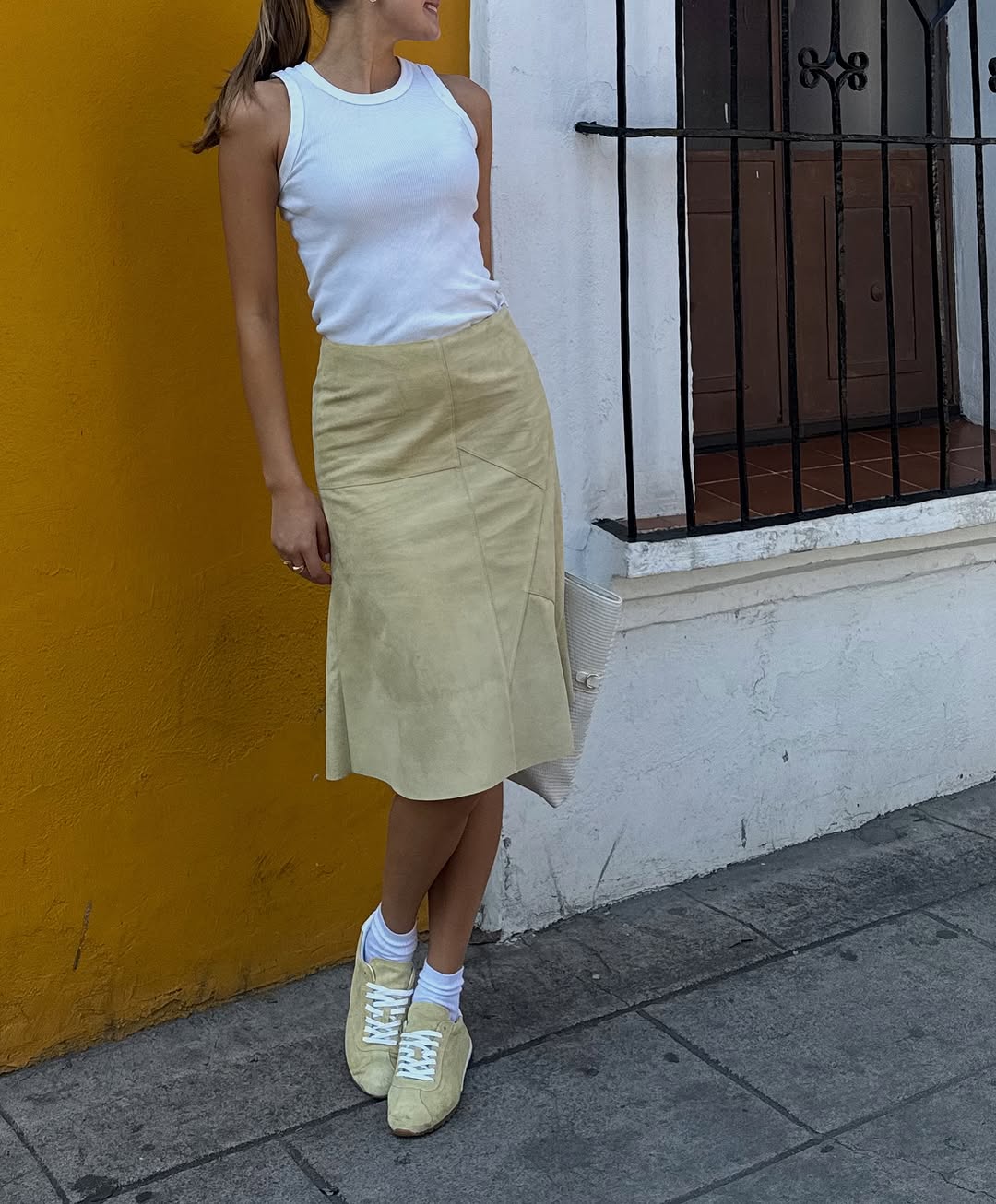 A woman wearing butter yellow shoes.