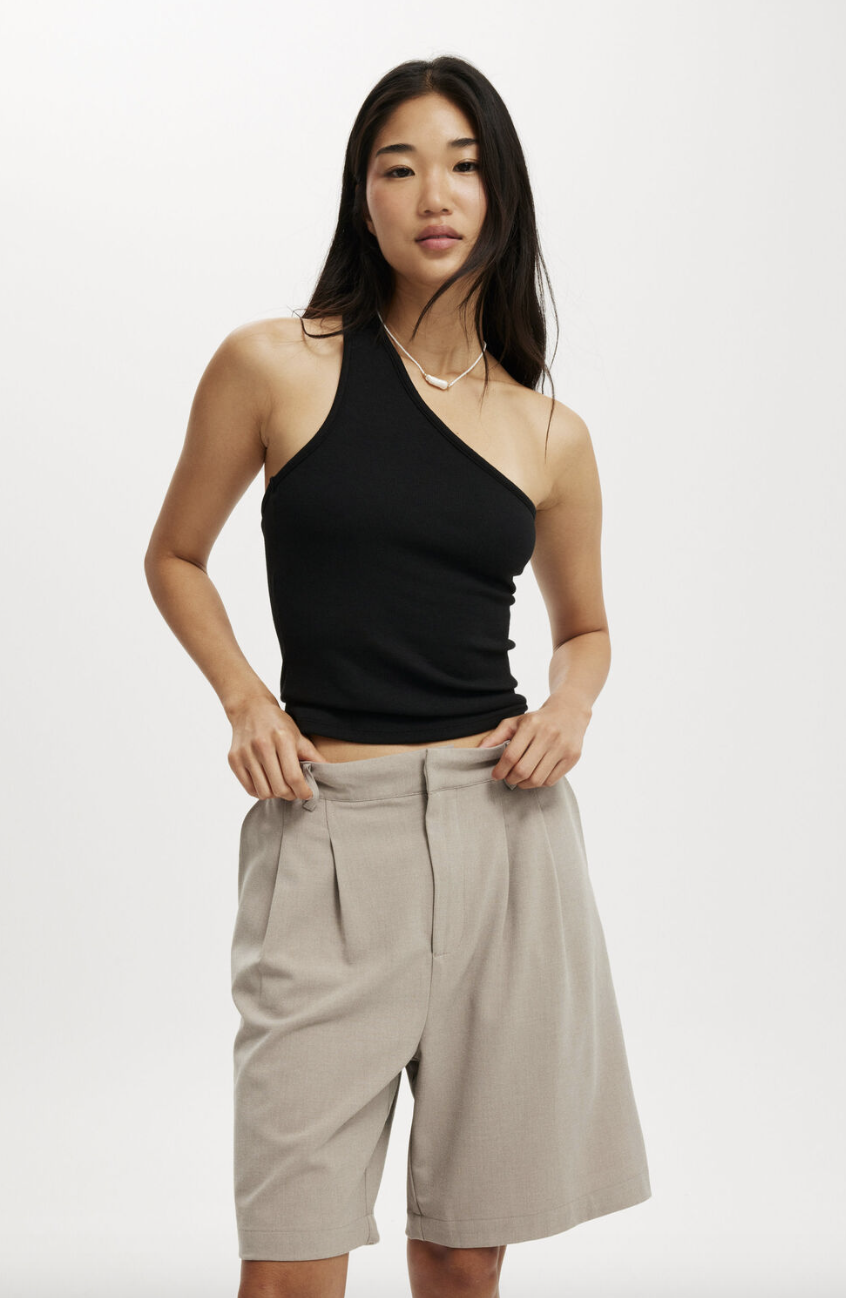 A model wearing tailored shorts.