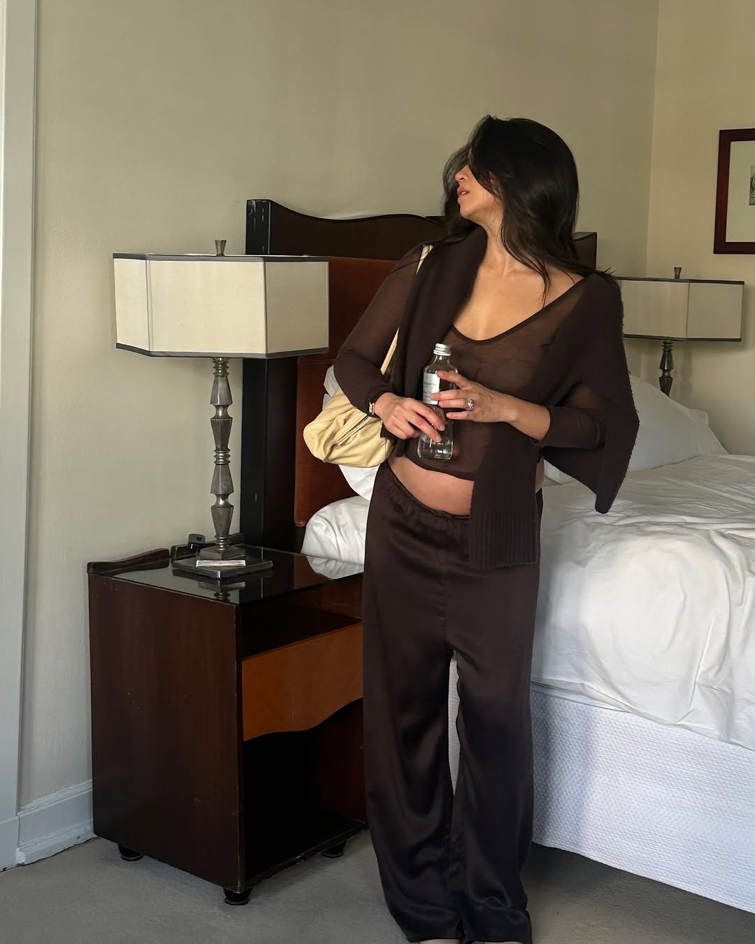 A woman wearing a brown outfit.