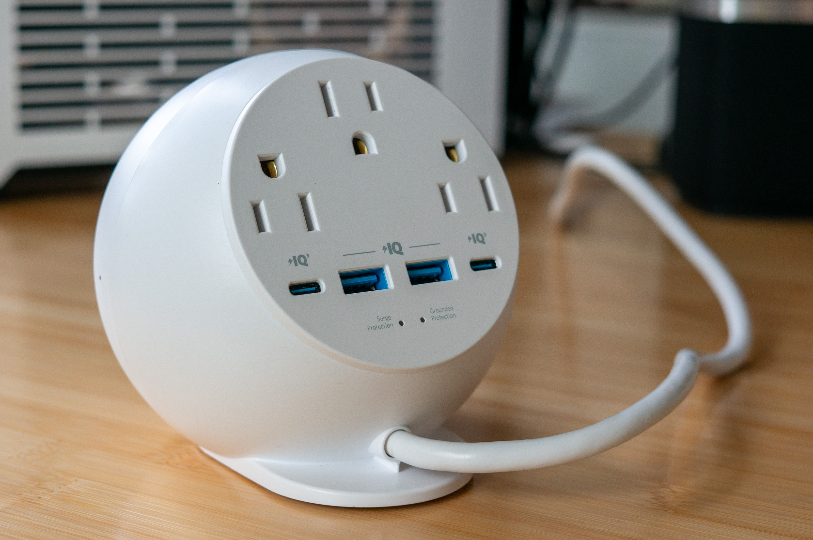 Rear view of the Anker 8-in-1 orb showing three AC outlets, two USB-A, and two USB-C ports.
