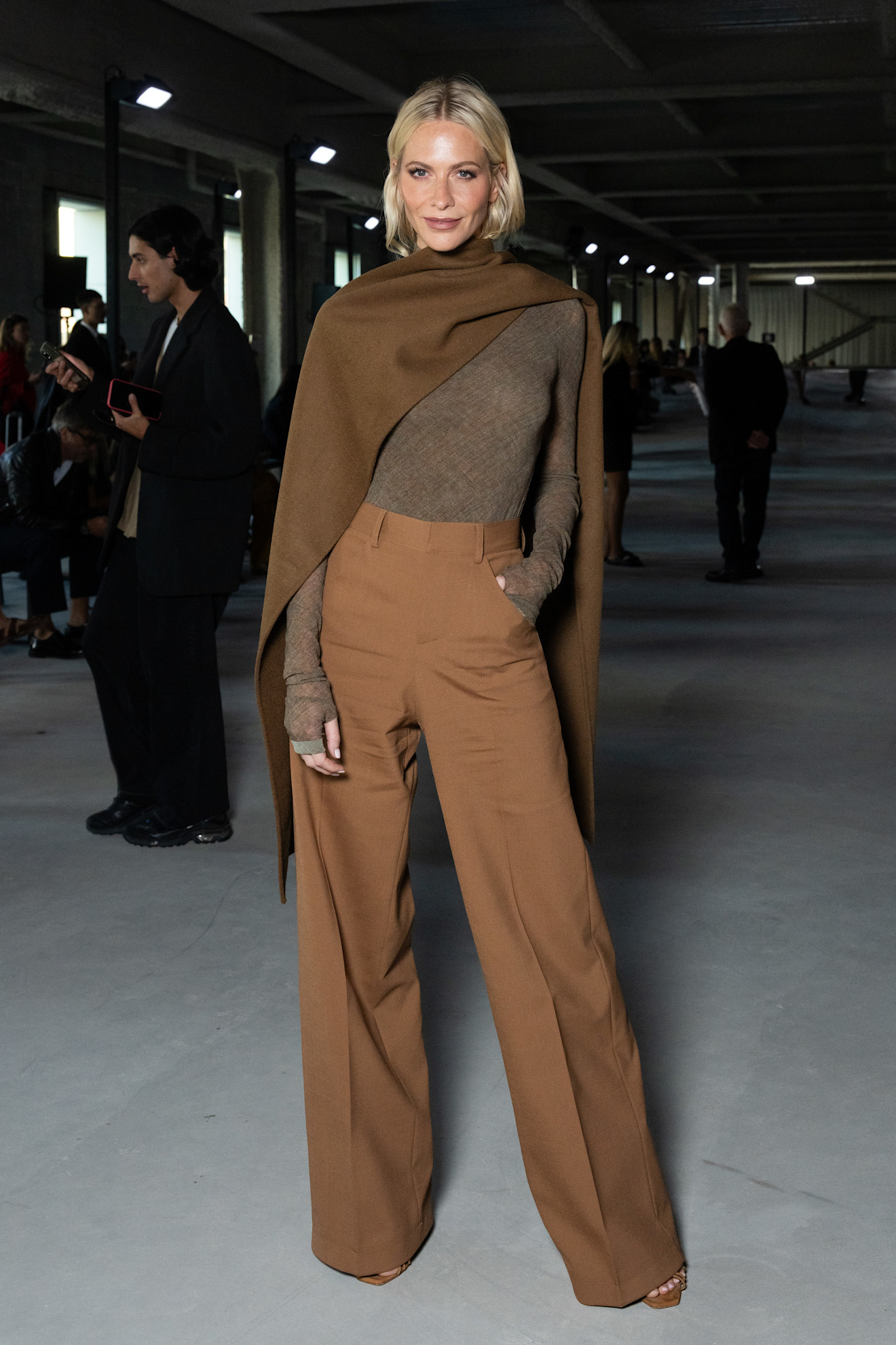 A woman wears elevated chinos.