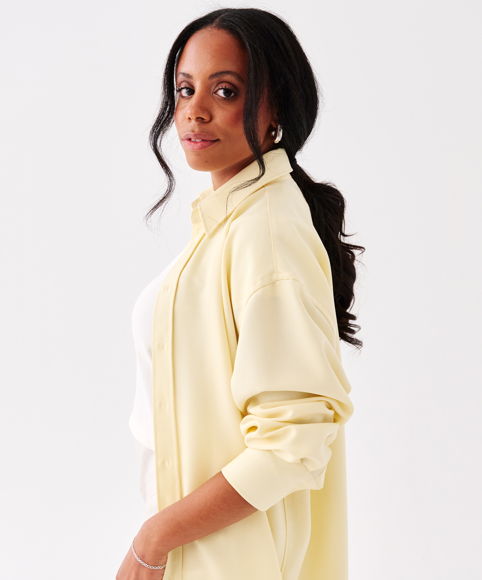 Sierra Mayhew wearing a pastel shirt.