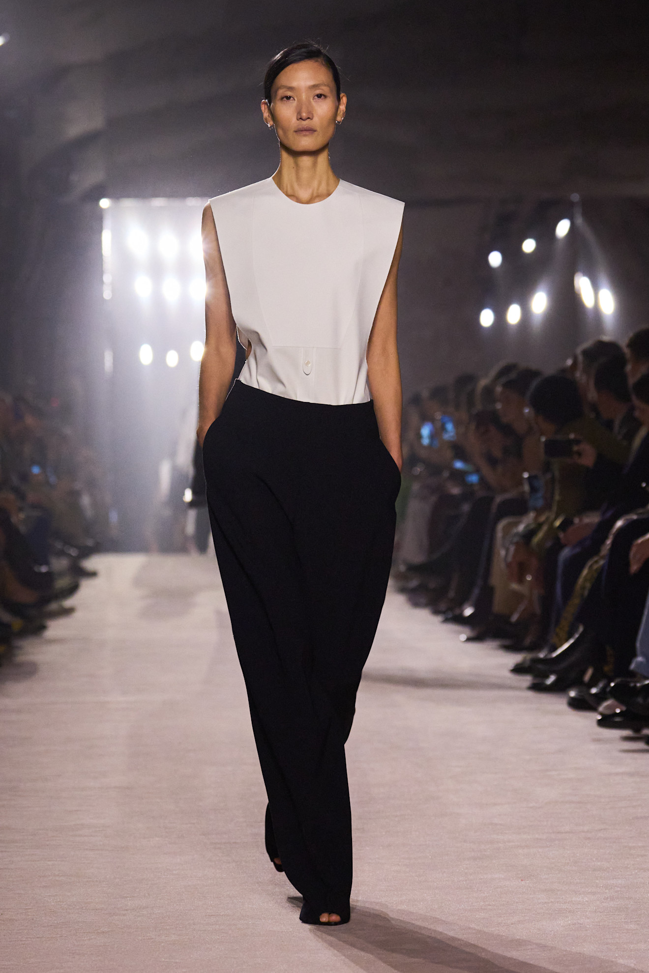 Model wears peep-toe shoes on the Victoria Beckham autumn/winter 2025 runway.