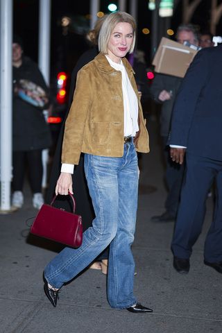 Naomi Watts wearing a suede jacket, jeans, and the Celine Antoinette bag in NYC