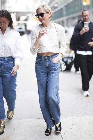 Michelle Williams wearing a white Chanel jacket, jeans, and peep-toe heels in NYC