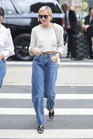 Michelle Williams wearing a white Chanel jacket, jeans, and peep-toe heels in NYC