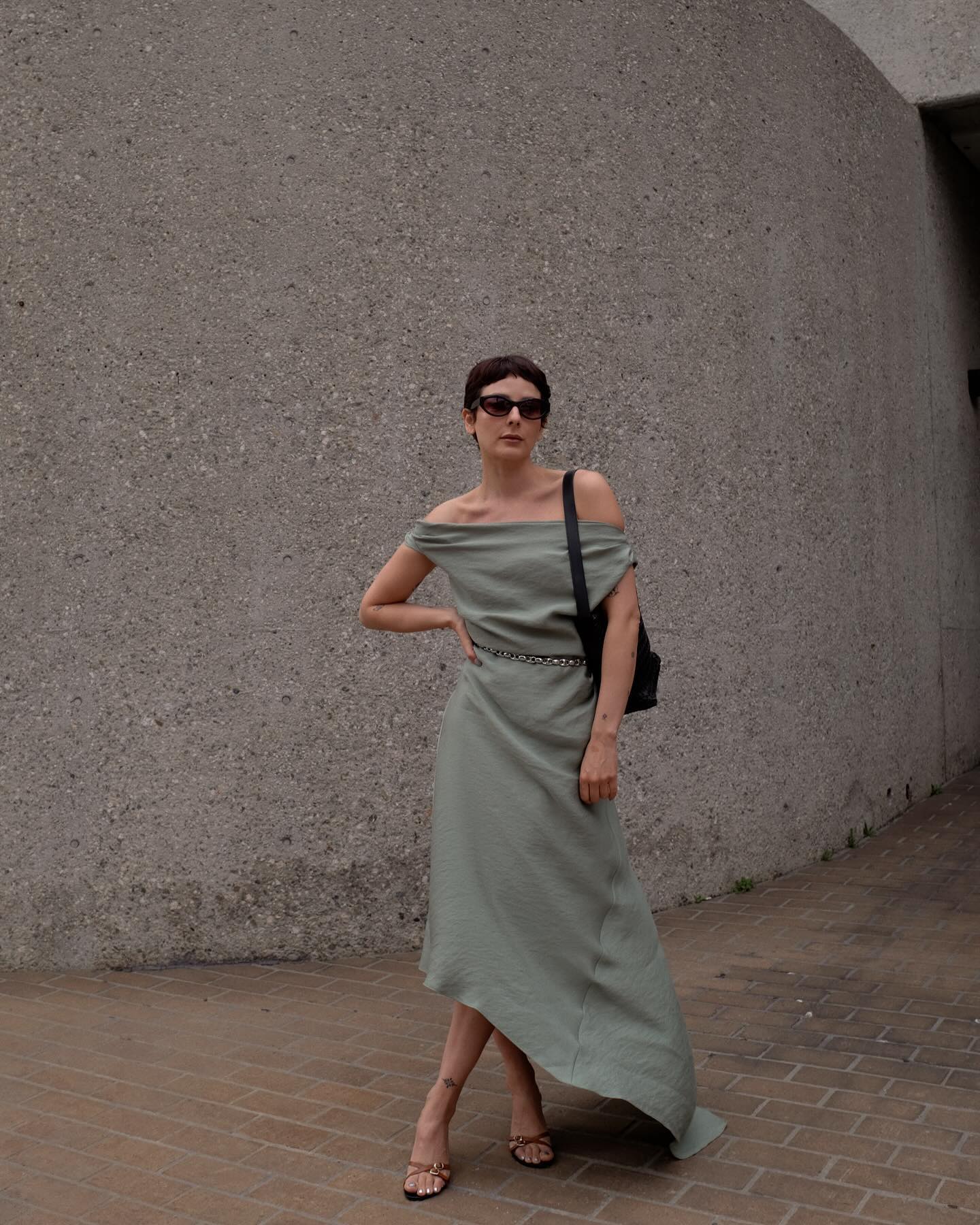 alyssa wears a gorgeous green off the shoulder dress with beautiuflly draped fabric
