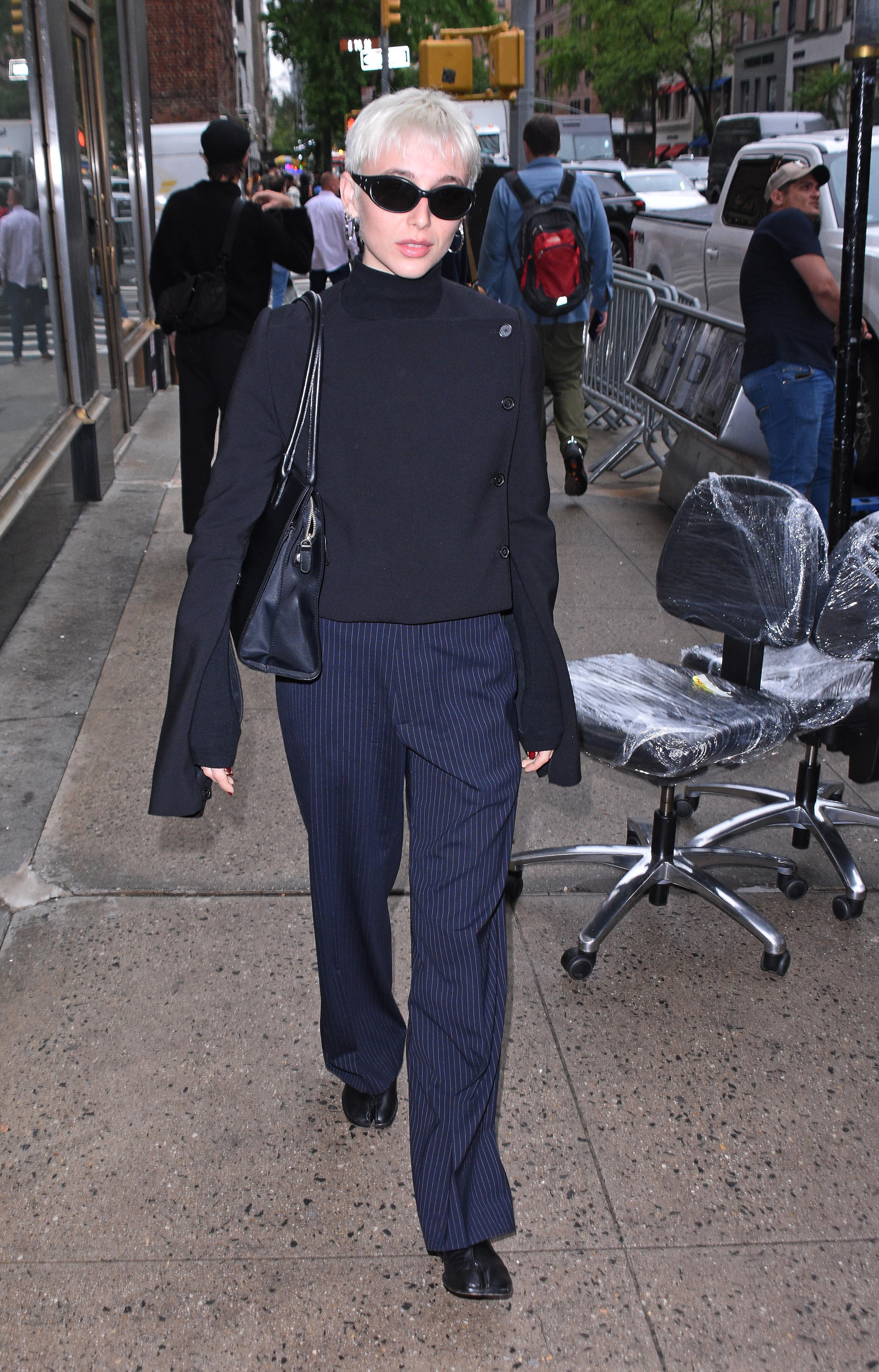 Emma Chamberlain wears tabi ballet flats.