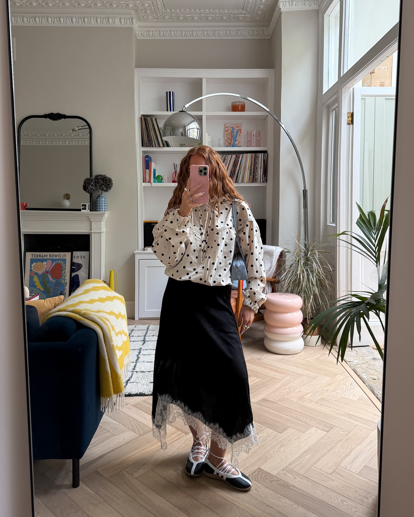 Influencer wears a lace trimmed skirt.