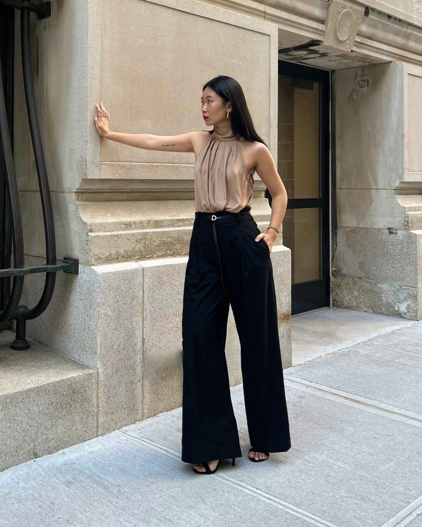 Influencer wears a halterneck blouse