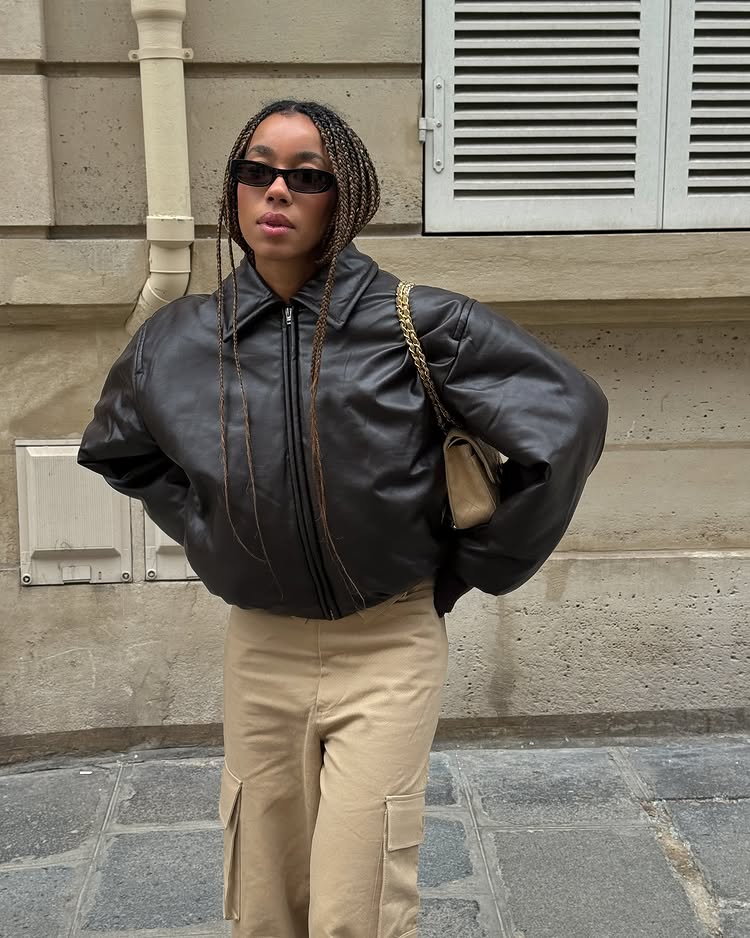 Stockholm Fashion Trends 2025: @amaka.hamelijnck wears a cropped leather jacket with beige cargo trousers