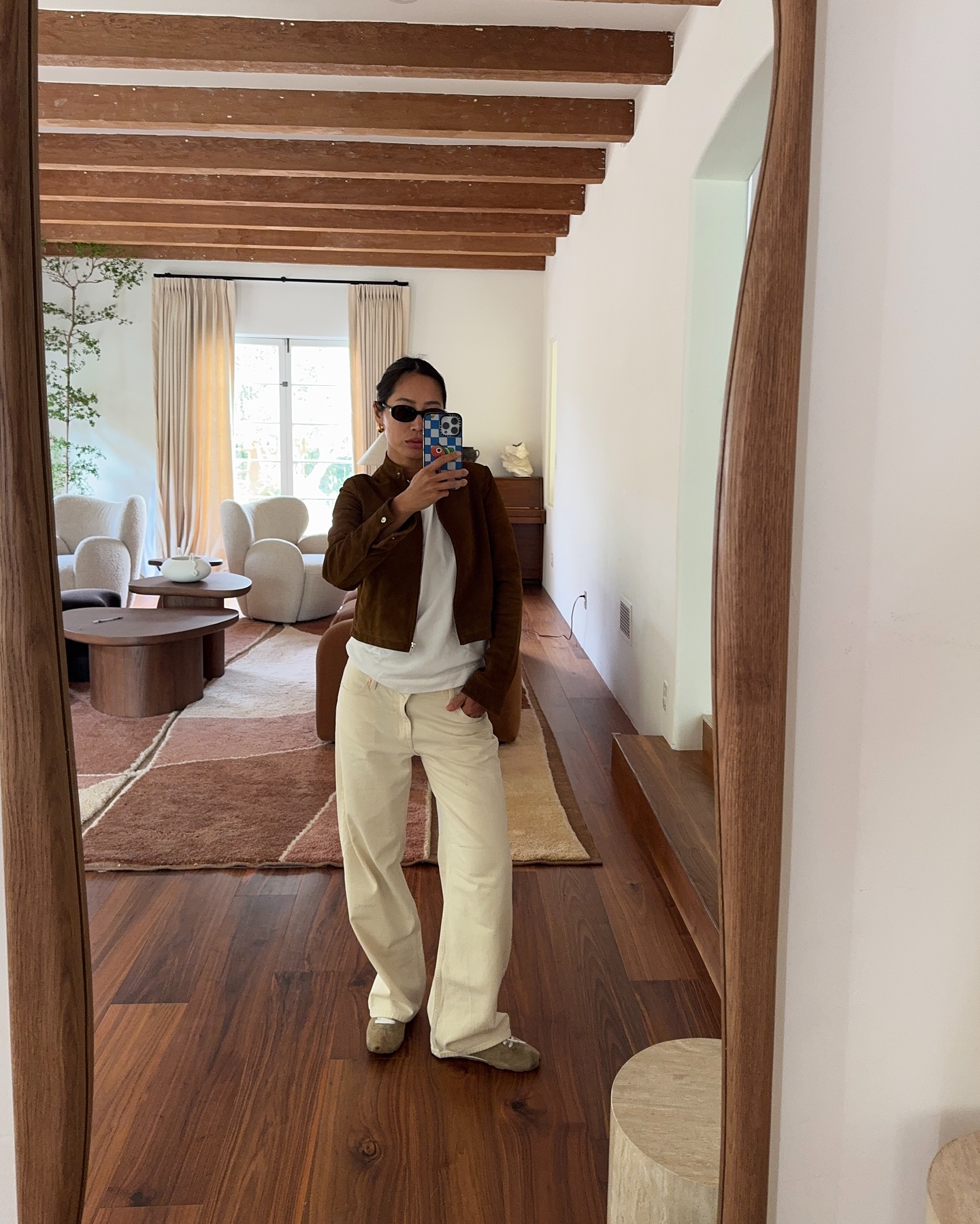 Woman showing how to style sneakers.