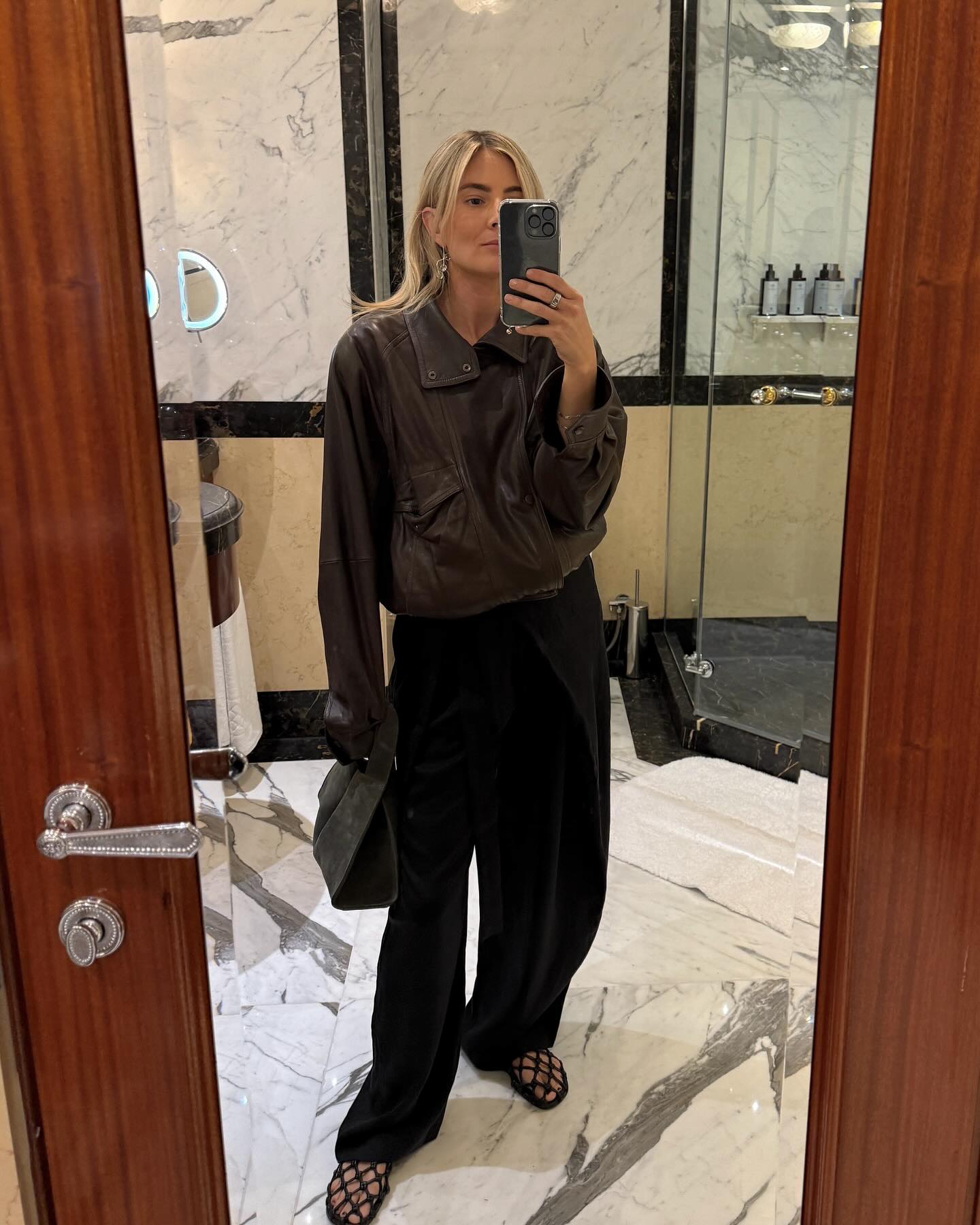 Influencer wears lattice ballet flats.