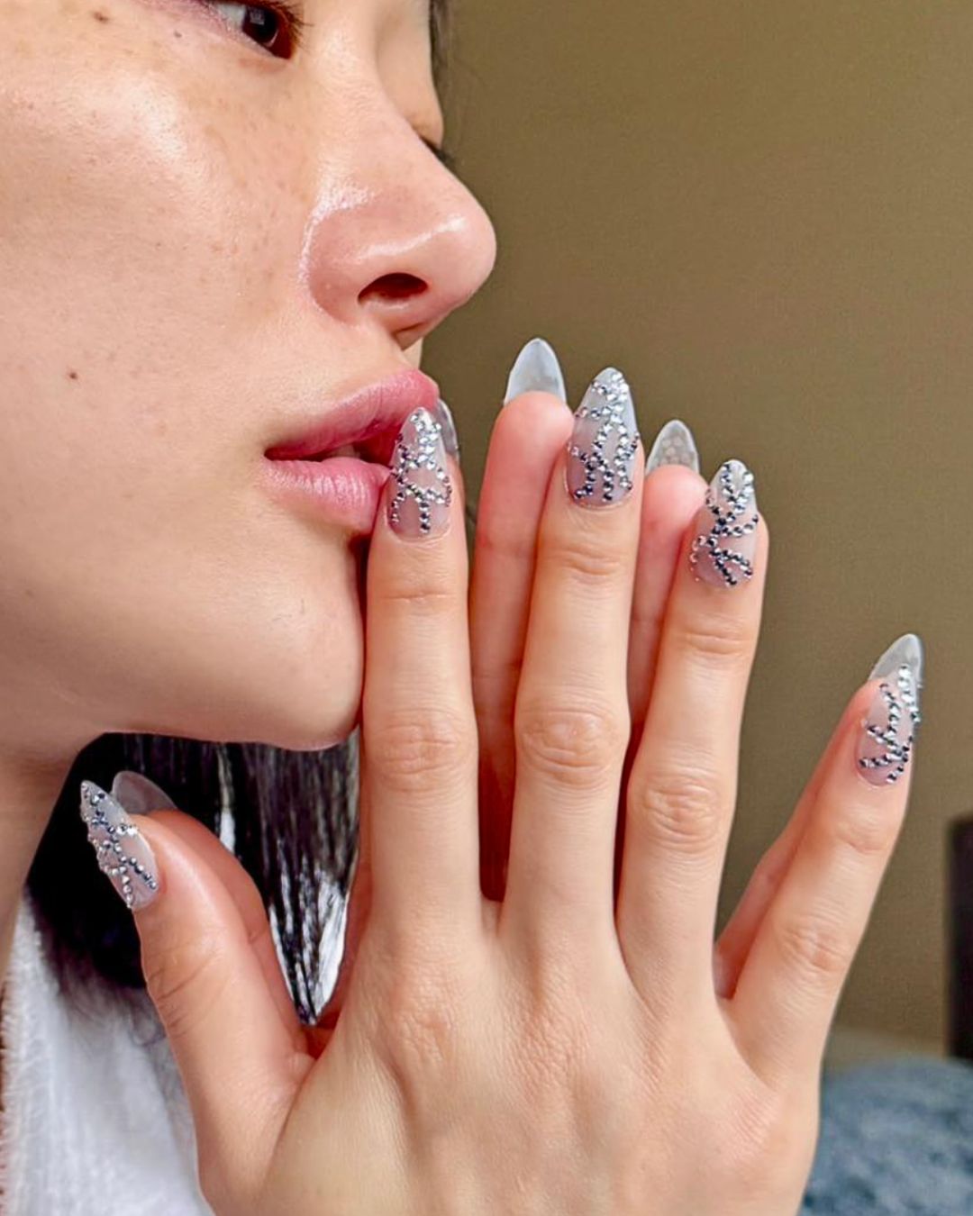 Sora Choi's sheer nails with crystals for the 2025 Met Gala, done by Jin Soon Choi.