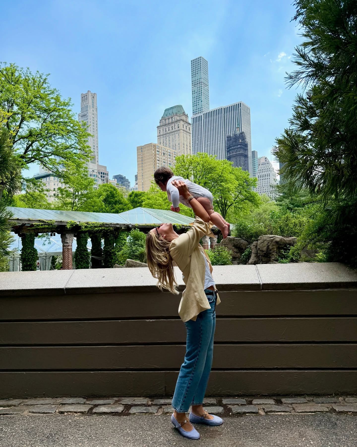 Influencer wears blue ballet flats.
