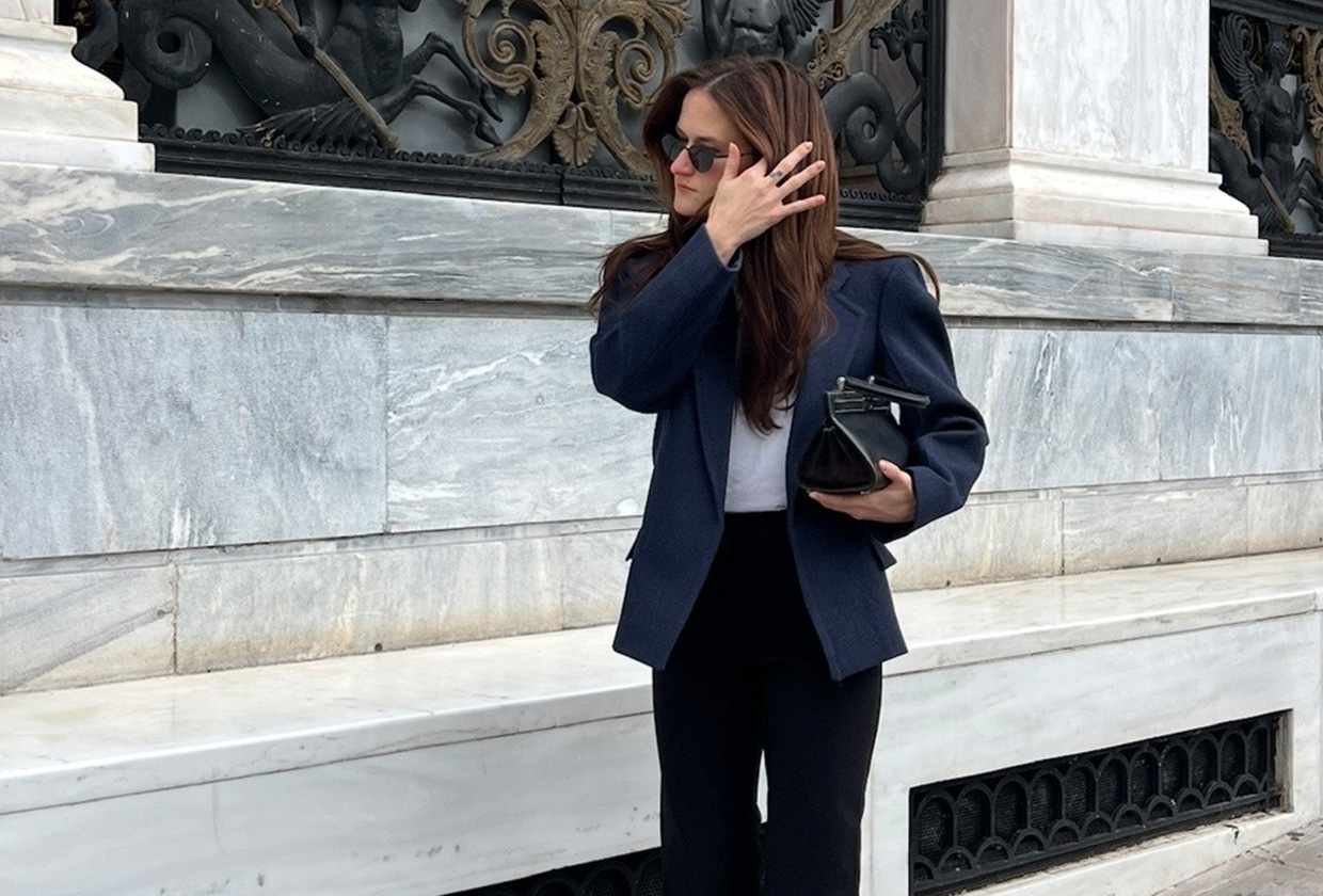 Eliza Huber wearing a COS blazer, capri pants, and flat shoes to the COS S/S 25 runway show in Athens, Greece.