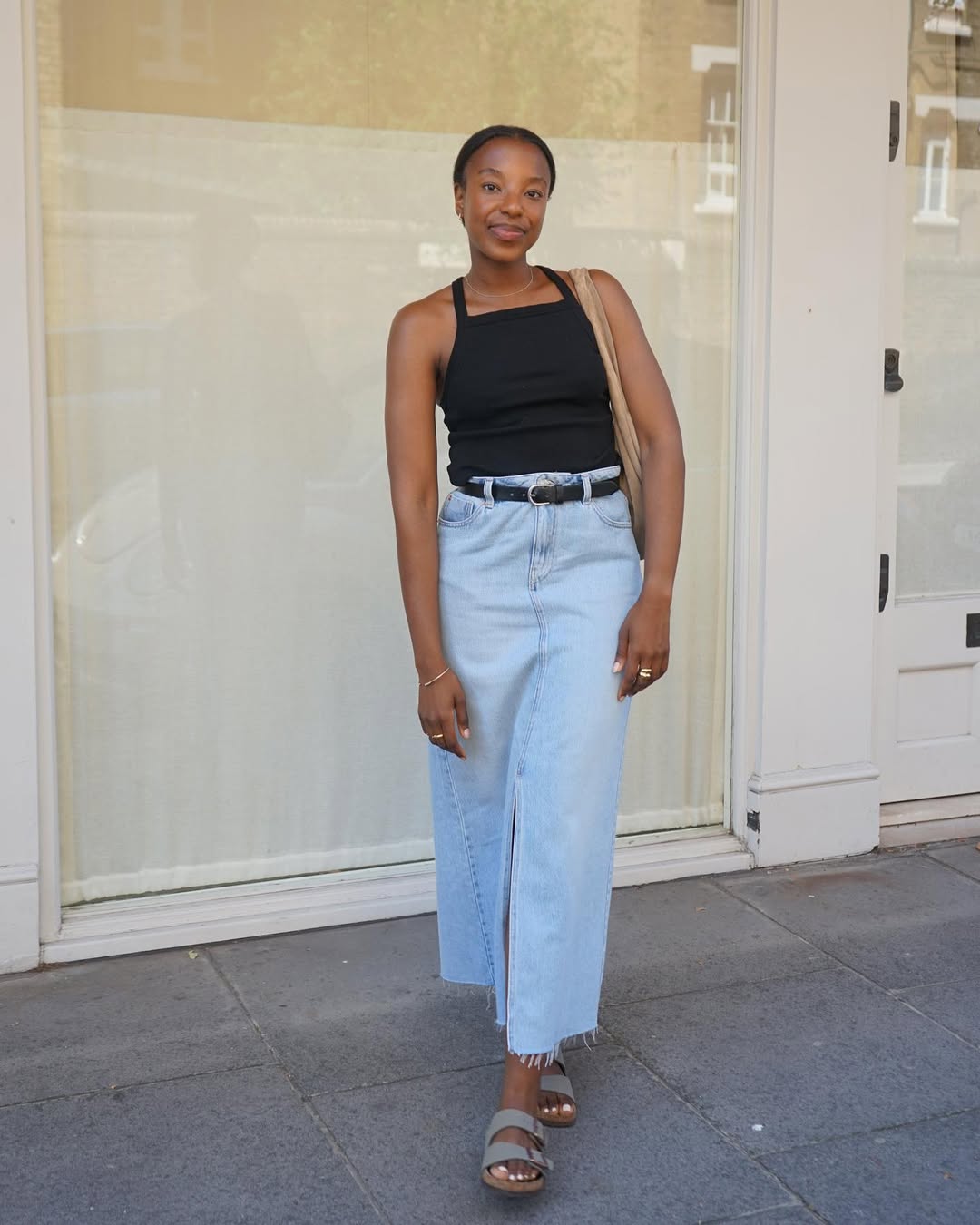 Taffy in a light wash denim maxi skirt