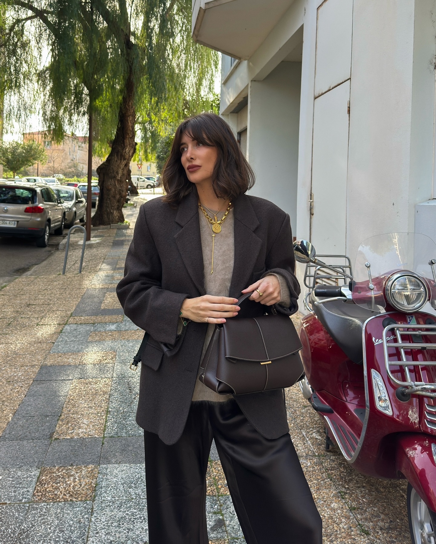 Julie Sergent Ferreri with draped bob and tailored outfit