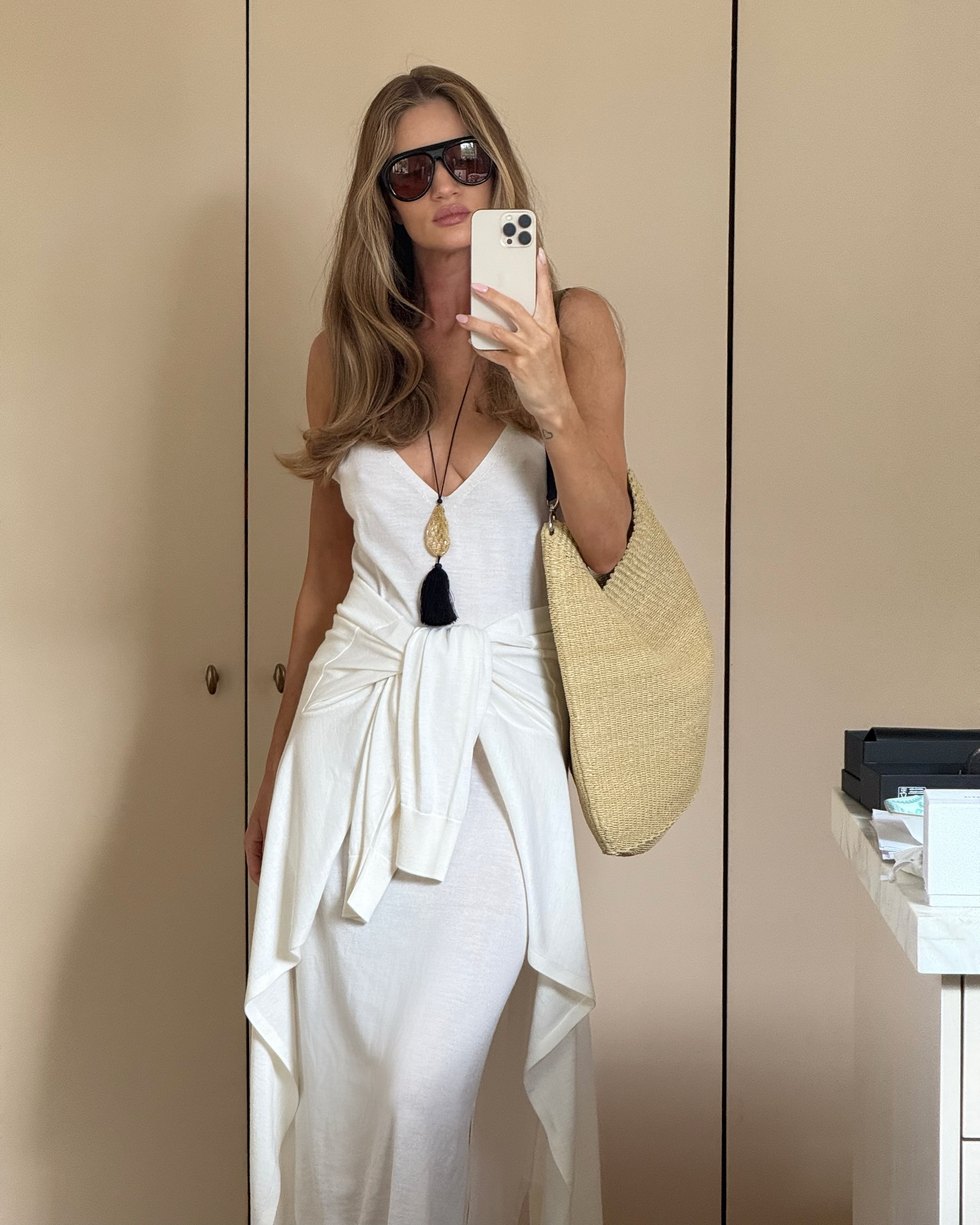 Rosie Huntington Whiteley wears a pendant necklace