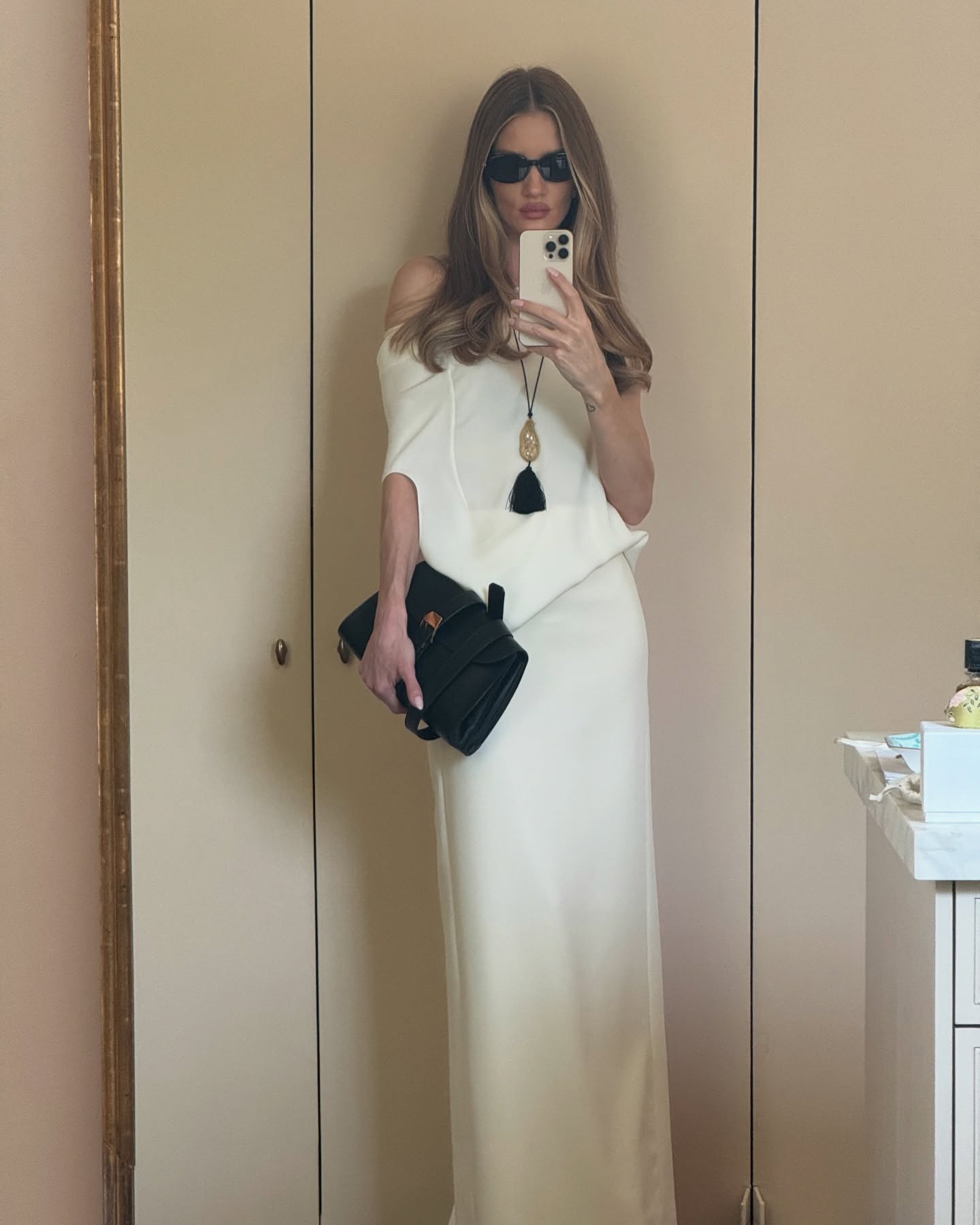 Rosie Huntington Whiteley wears a pendant necklace