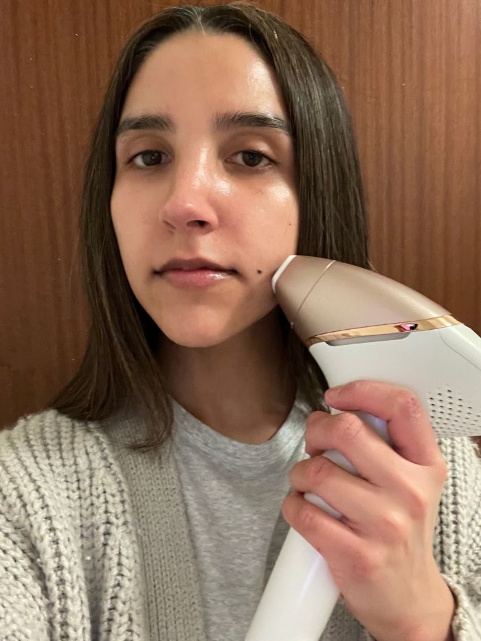 Junior branded content editor Humaa Hussain testing a Philips IPL device