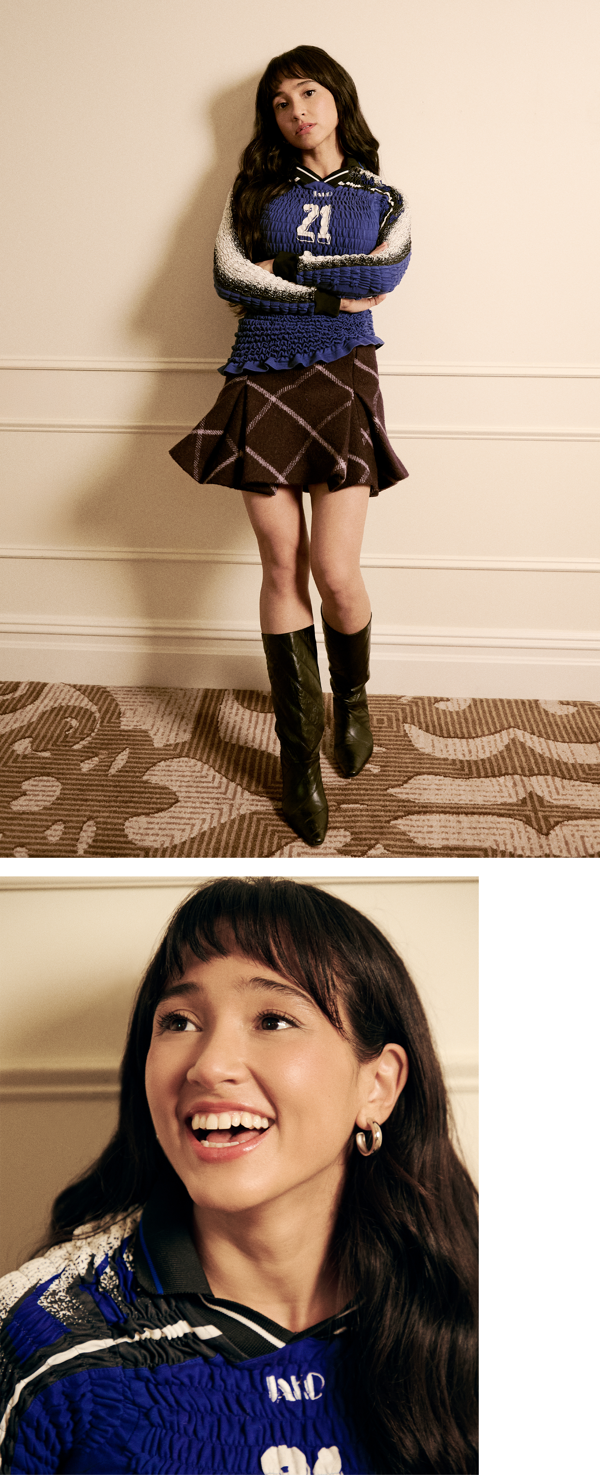 Overcompensating actress Wally Baram poses for portrait at the Plaza Hotel in NYC. She is wearing a long-sleeve smocked blue shirt with the number 21 on the front and a purple plaid miniskirt with black leather boots that hit just below the knee.