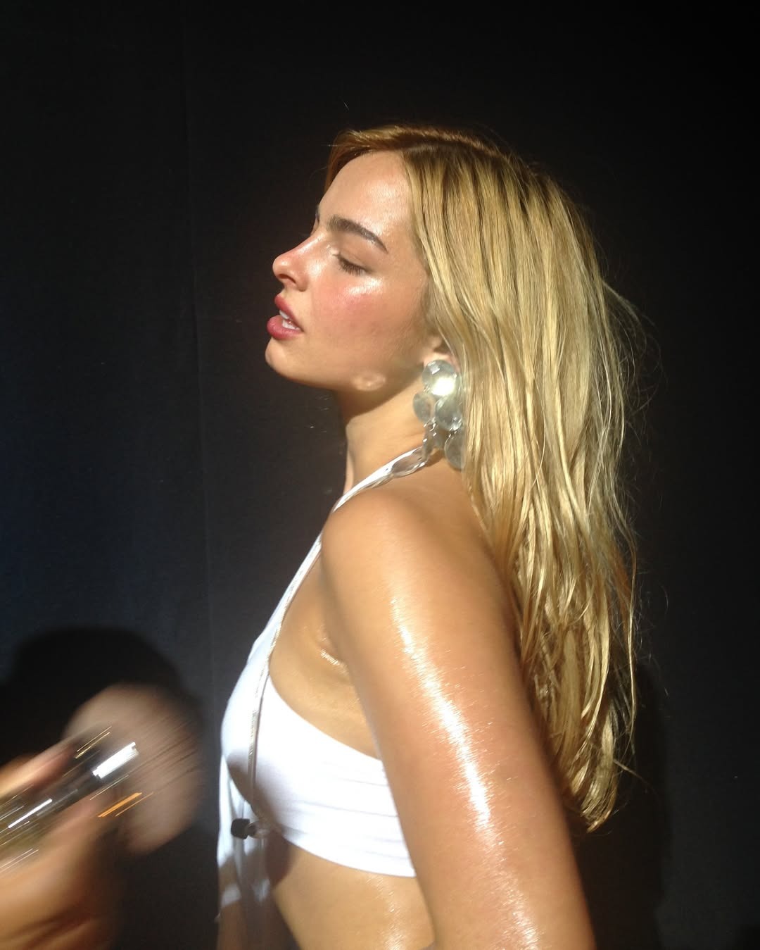 Addison Rae getting her makeup applied.