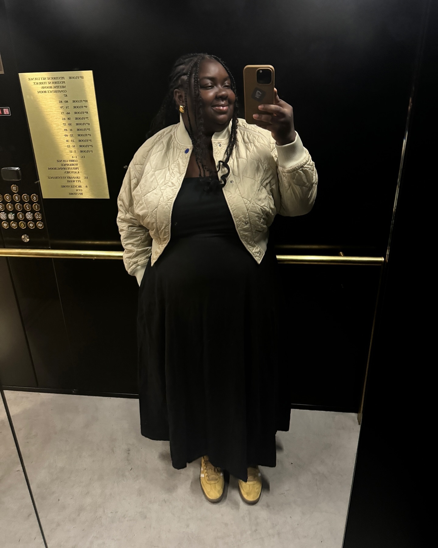 Influencer wears butter yellow sneakers.