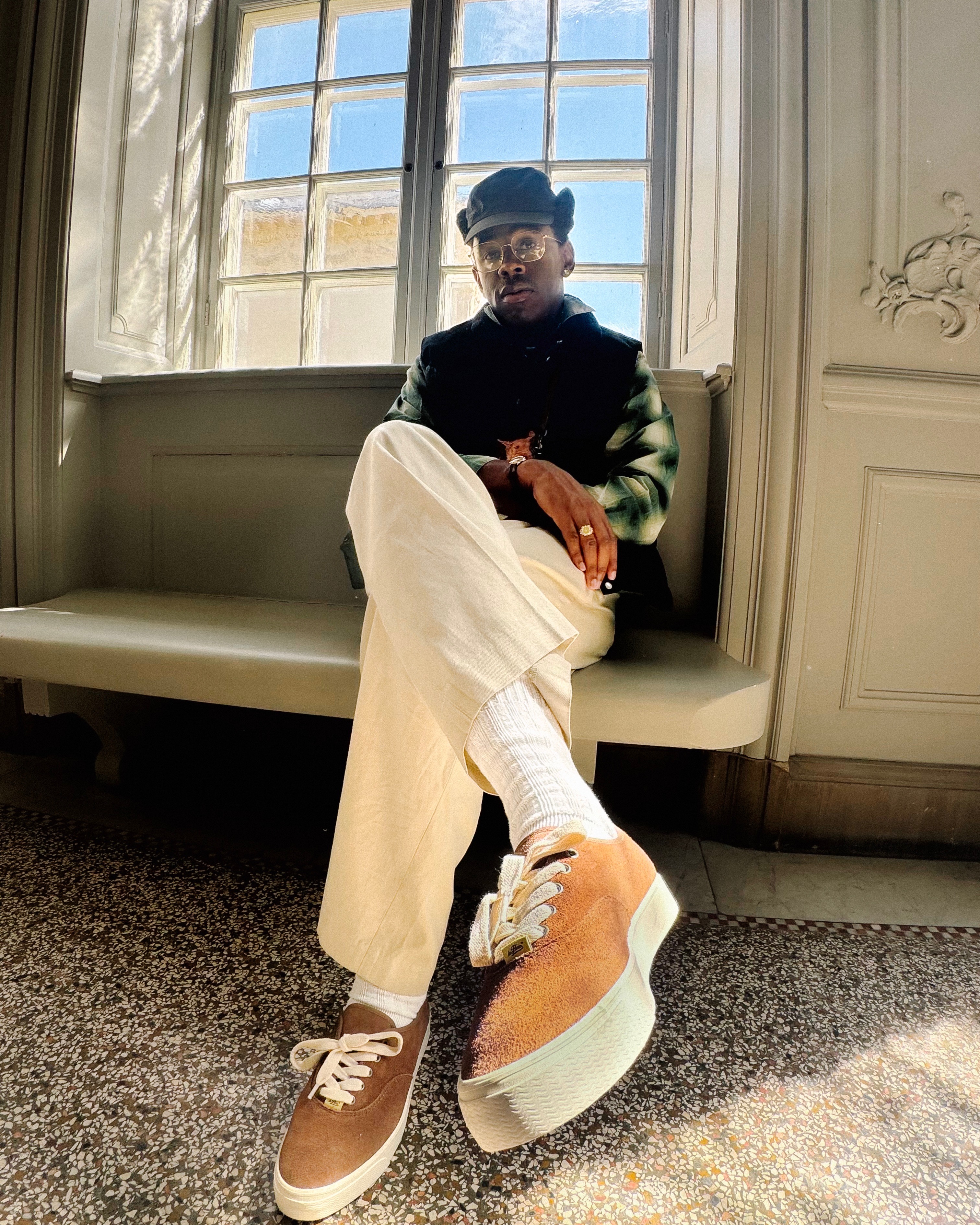 tyler wears black top, white pants, and Naut 1 boat shoe