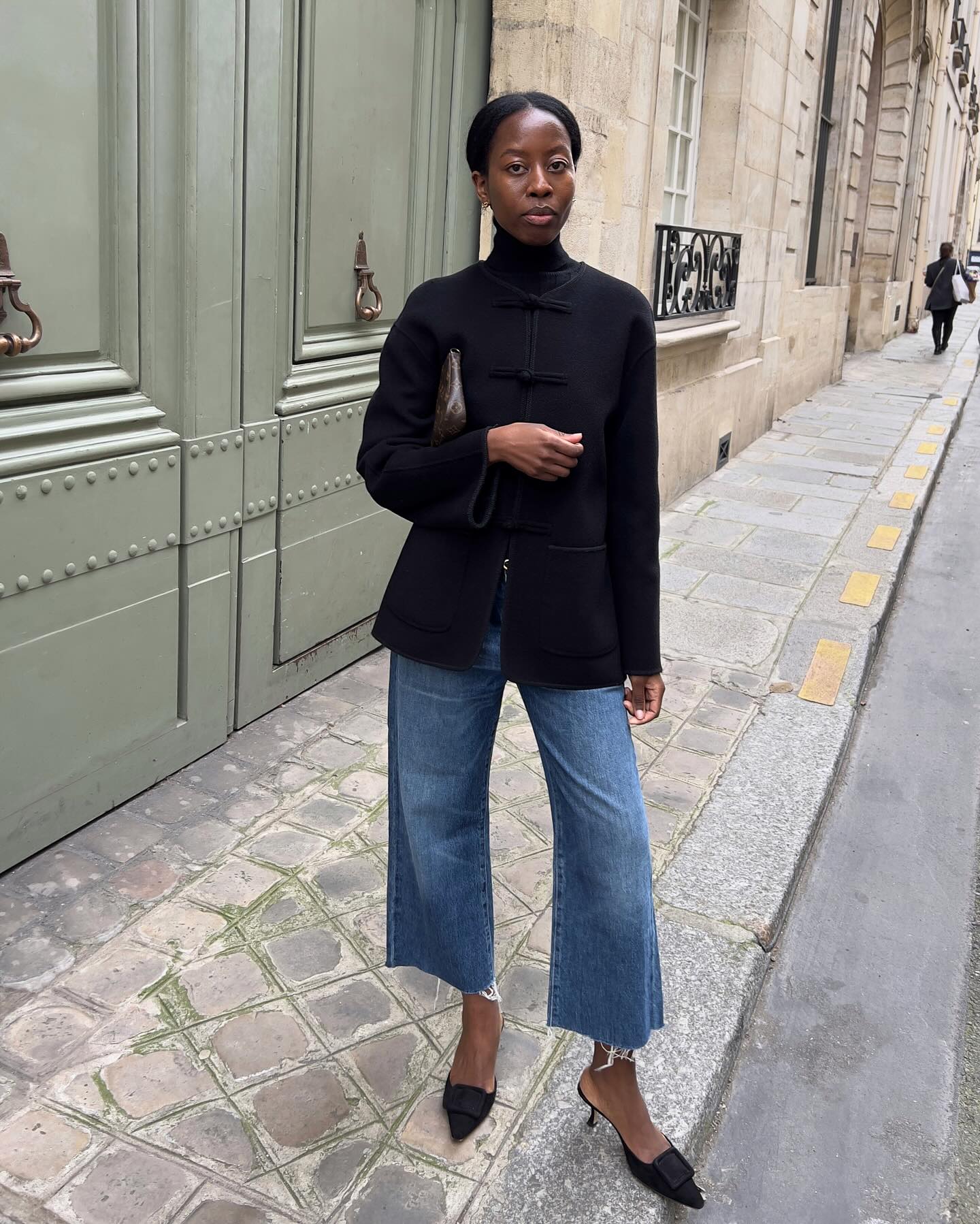 A French woman wearing cropped flares and heels