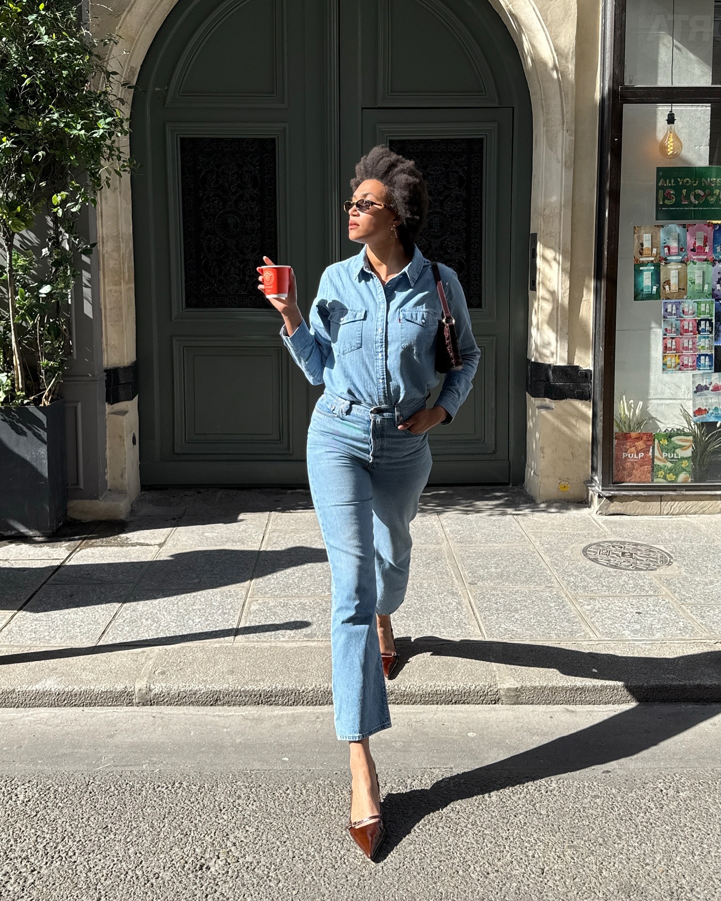 A French woman wearing cropped flares and heels