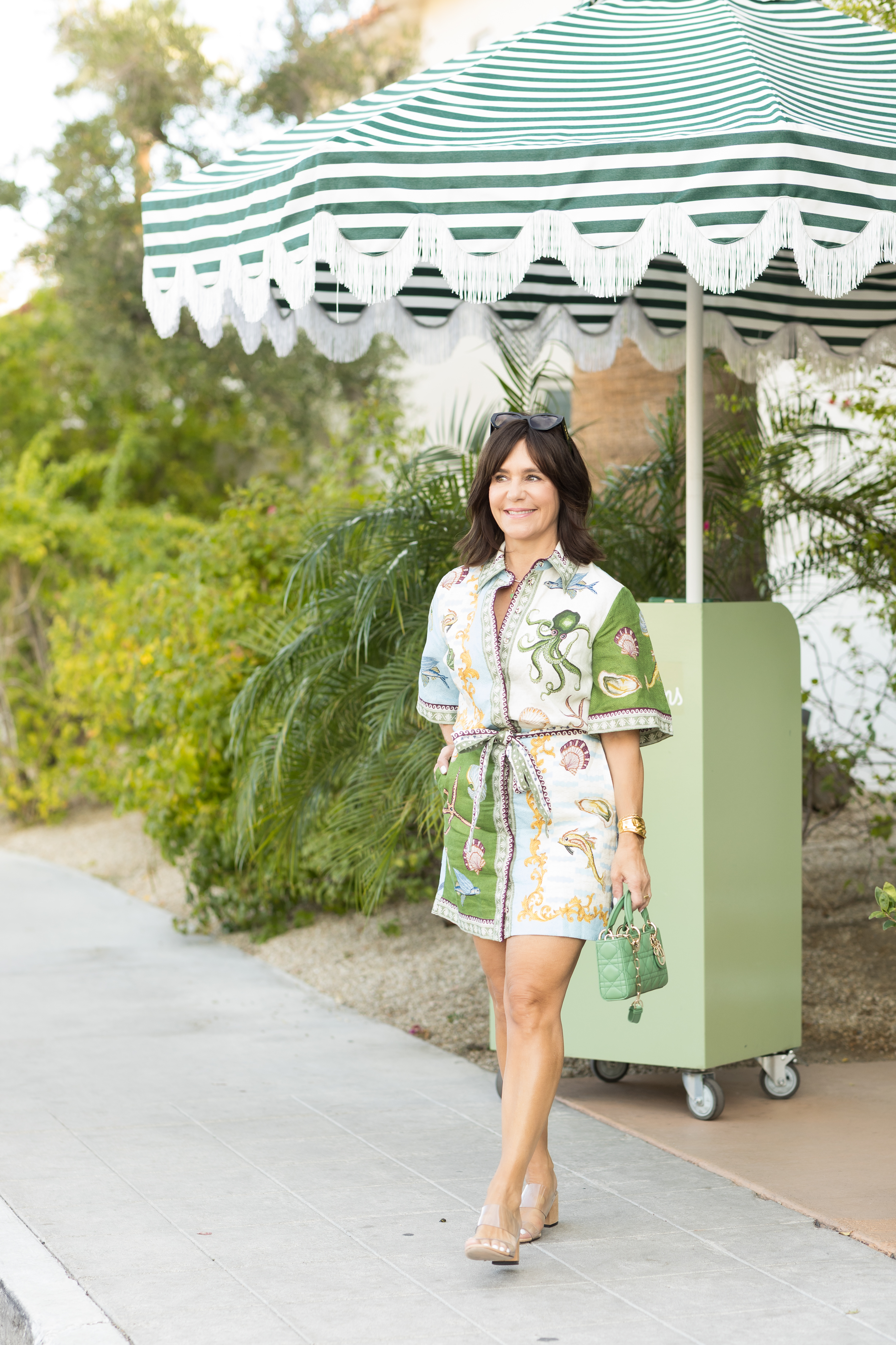 A Nordstrom buyer wearing a linen vacation dress.