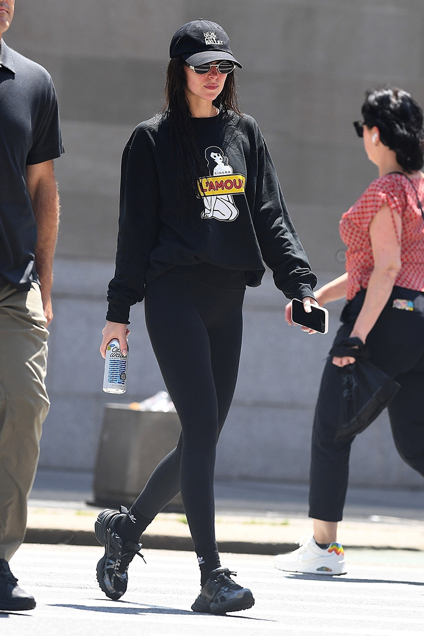 Dakota Johnson wearing leggings and Nike sneakers