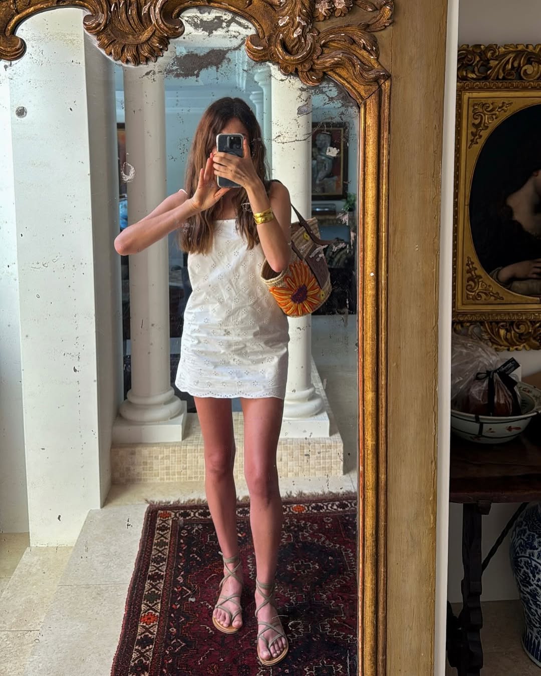 Sara Loura wearing a white eyelet dress