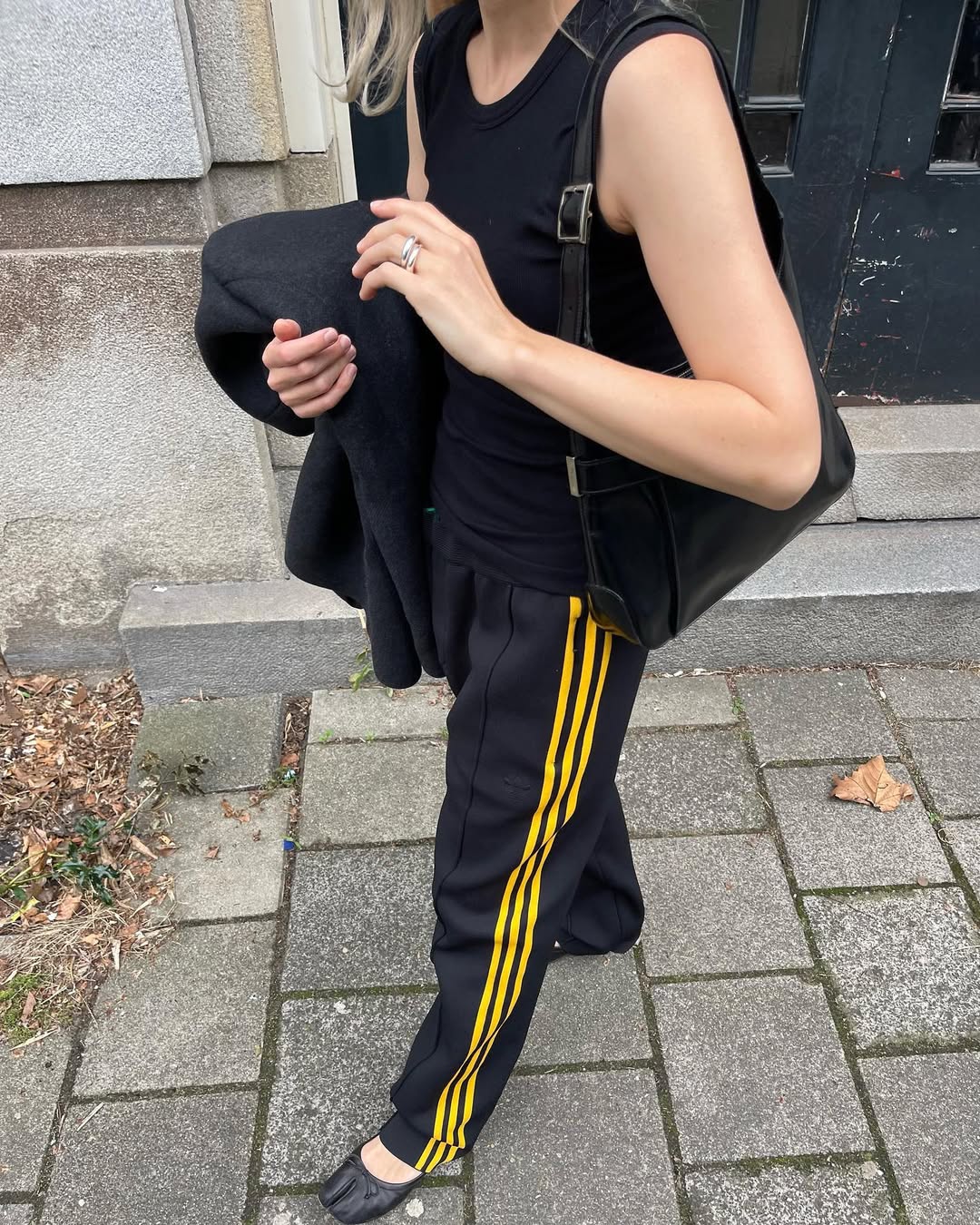 An influencer wearing track pants.