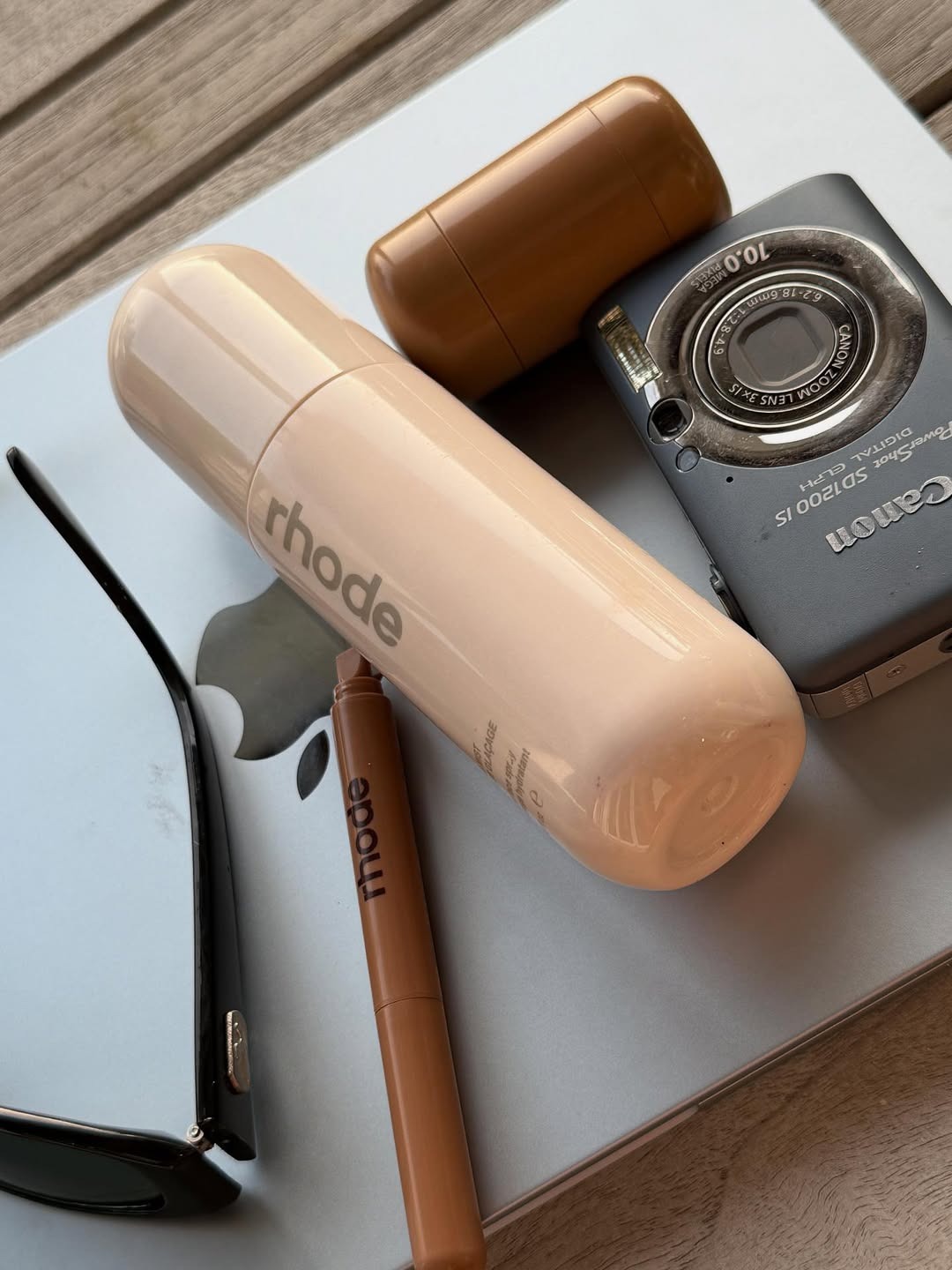 The Rhode Glazing Mist in a group shot of Rhode beauty products.