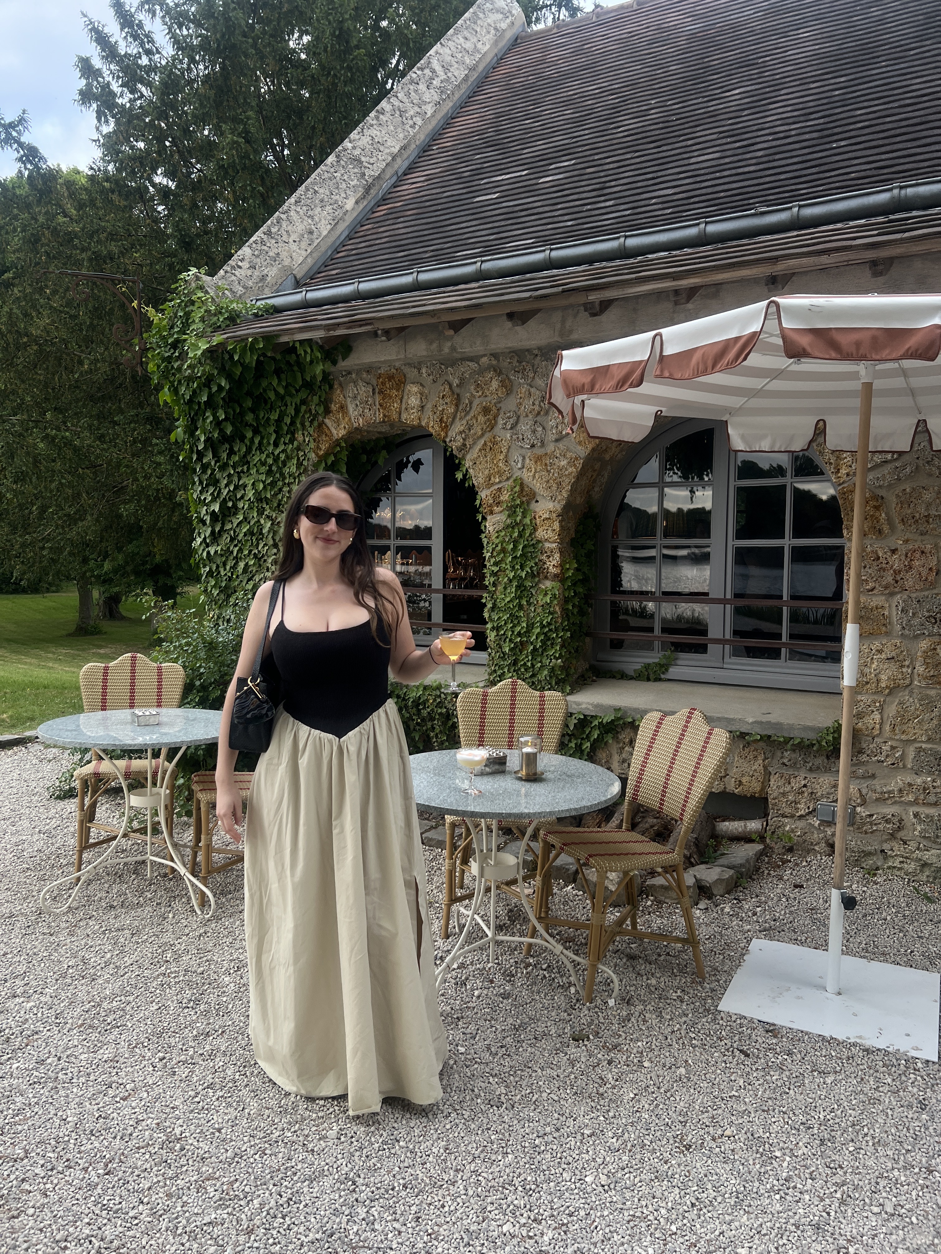 An image of Who What Wear SEO Writer @avahgilchrist wearing a waisted dress from DISSH.