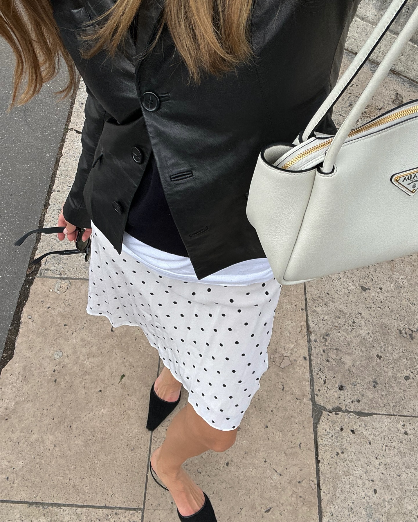 French summer 2025 fashion trends: @annelauremais wears a polka dot skirt