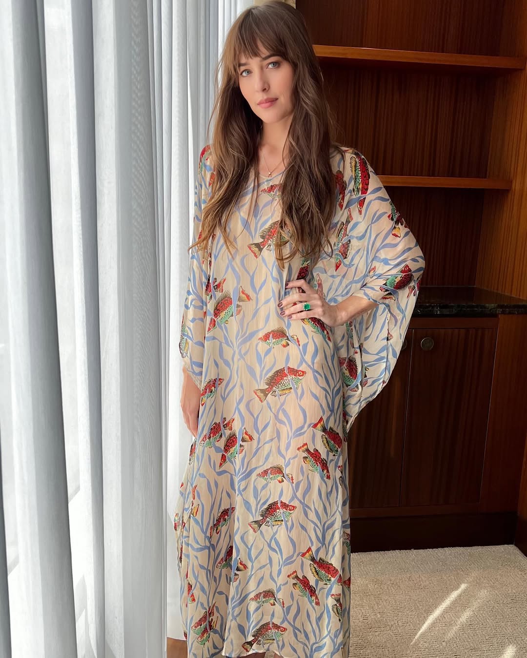 Caftan trend seen on Dakota Johnson.