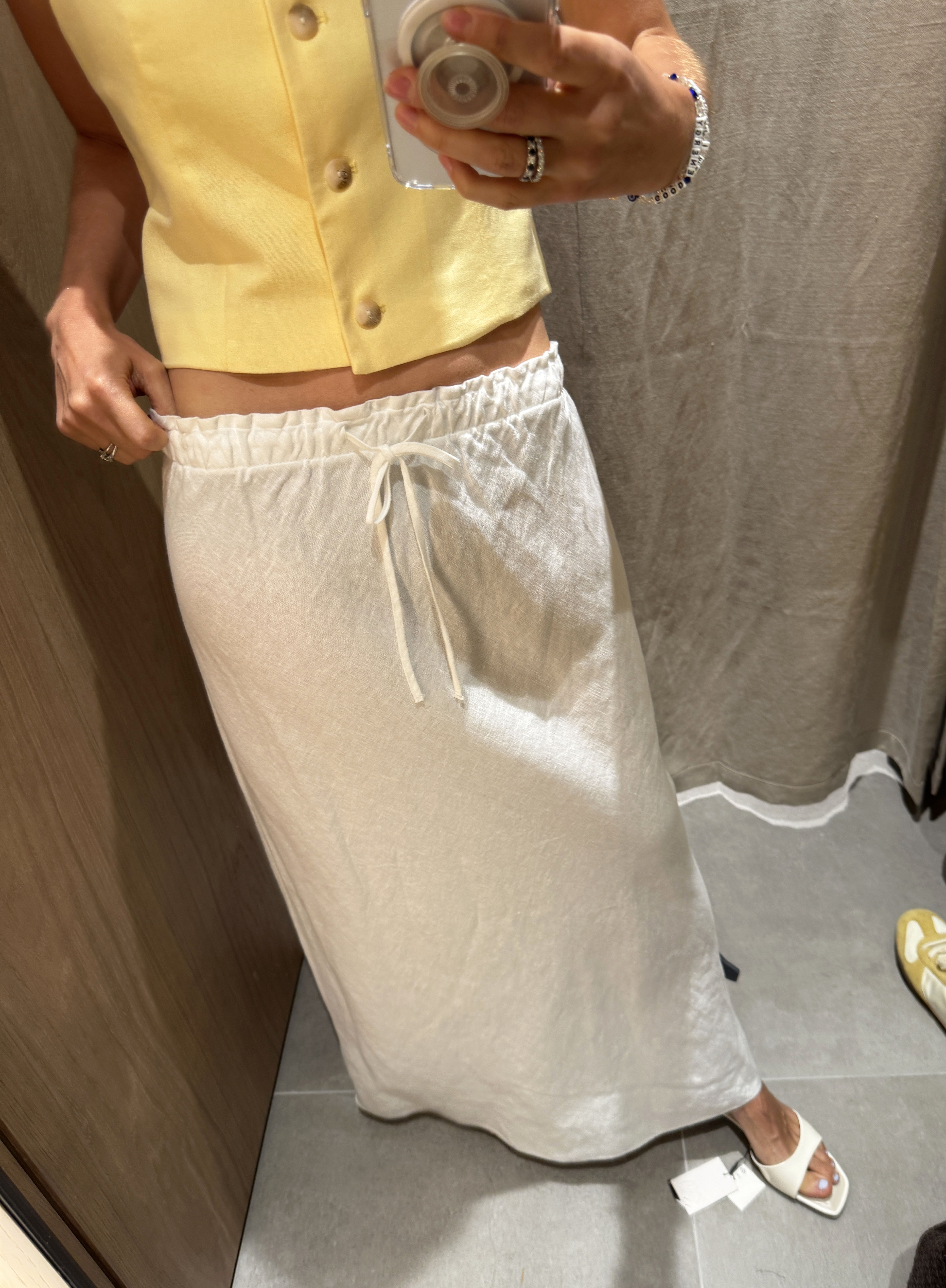 Woman in white linen maxi dress