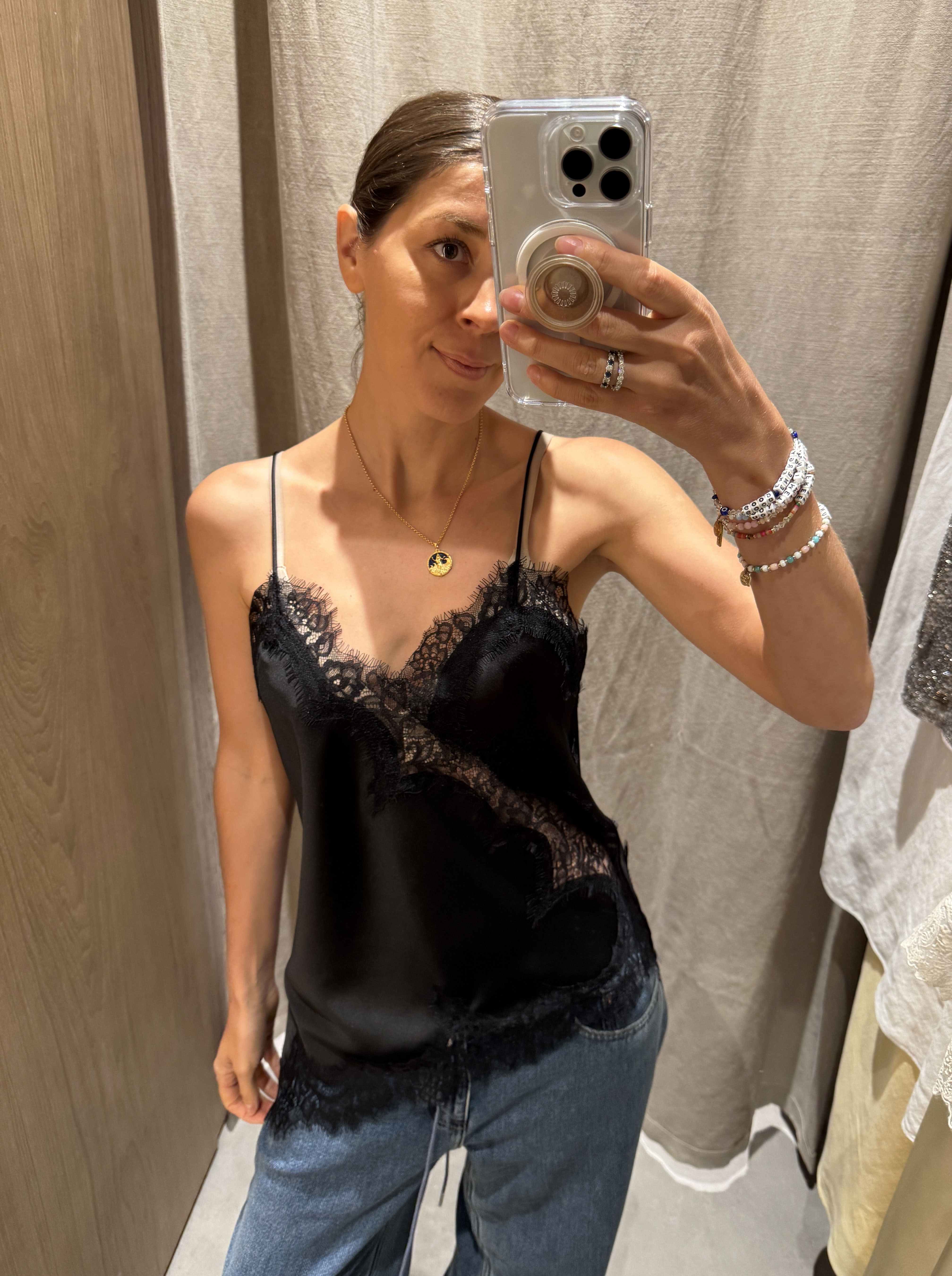 Woman in black camisole top