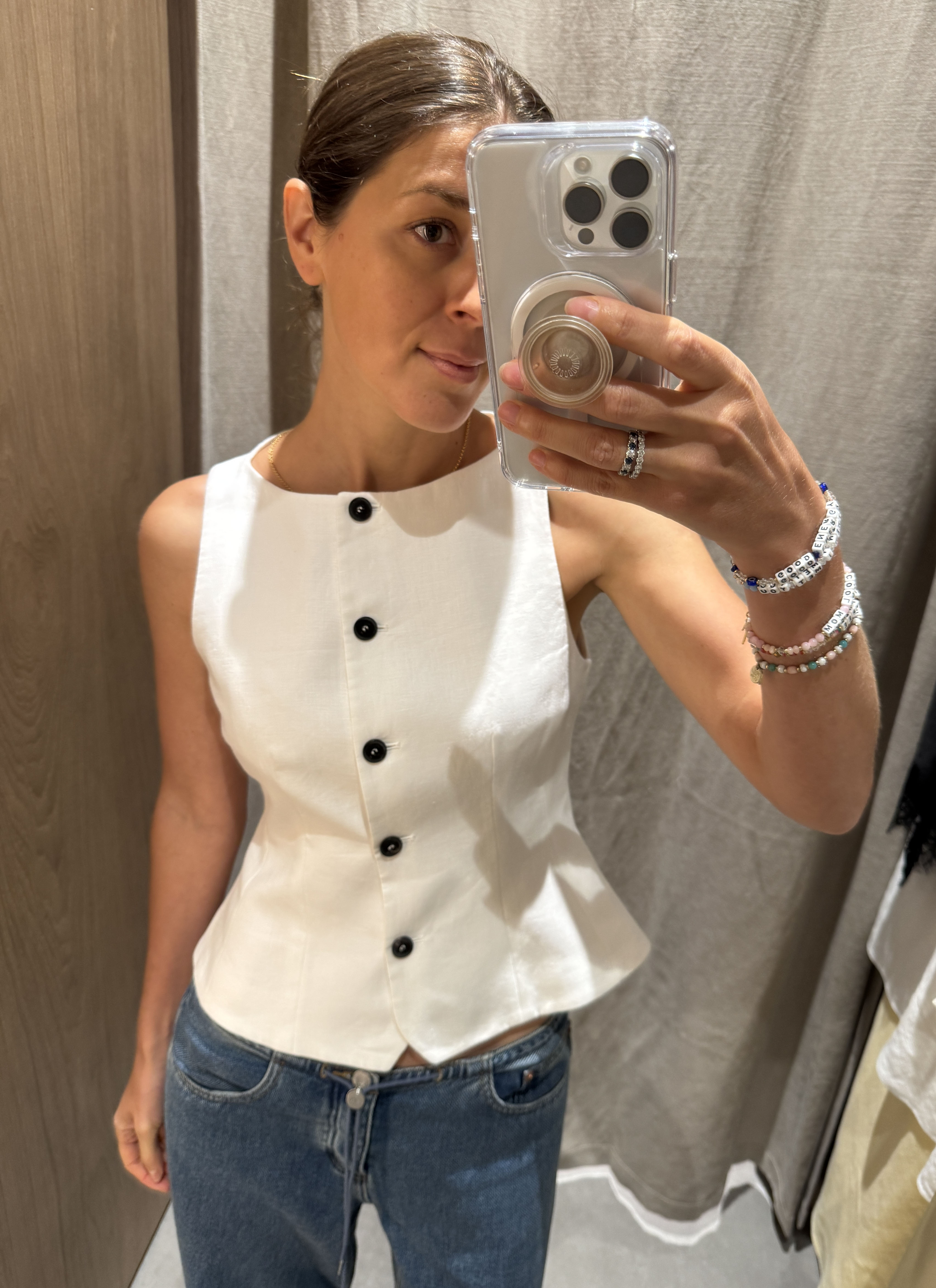 Woman in white linen vest