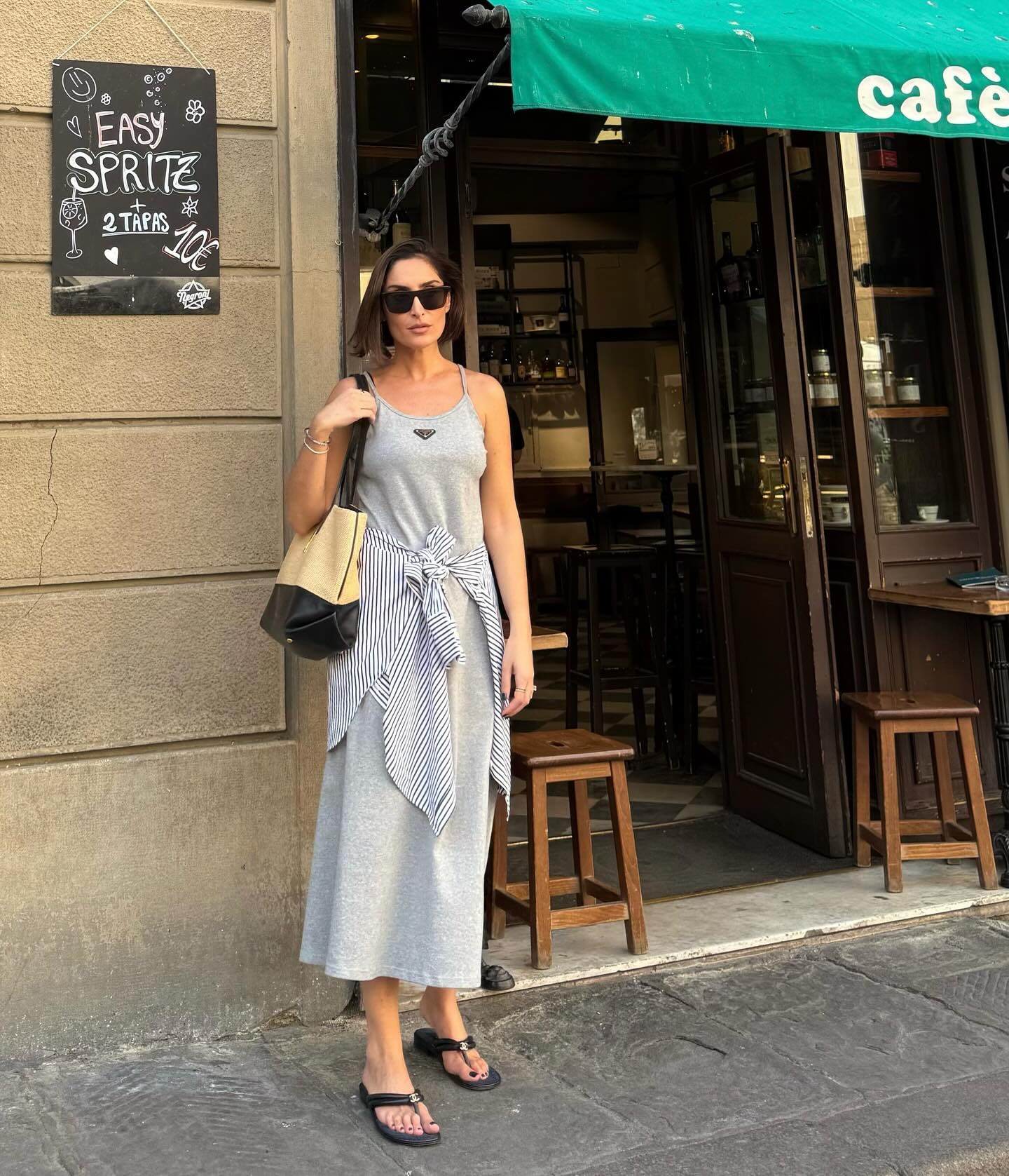 Influencer wearing a maxi dress and sandals in Italy