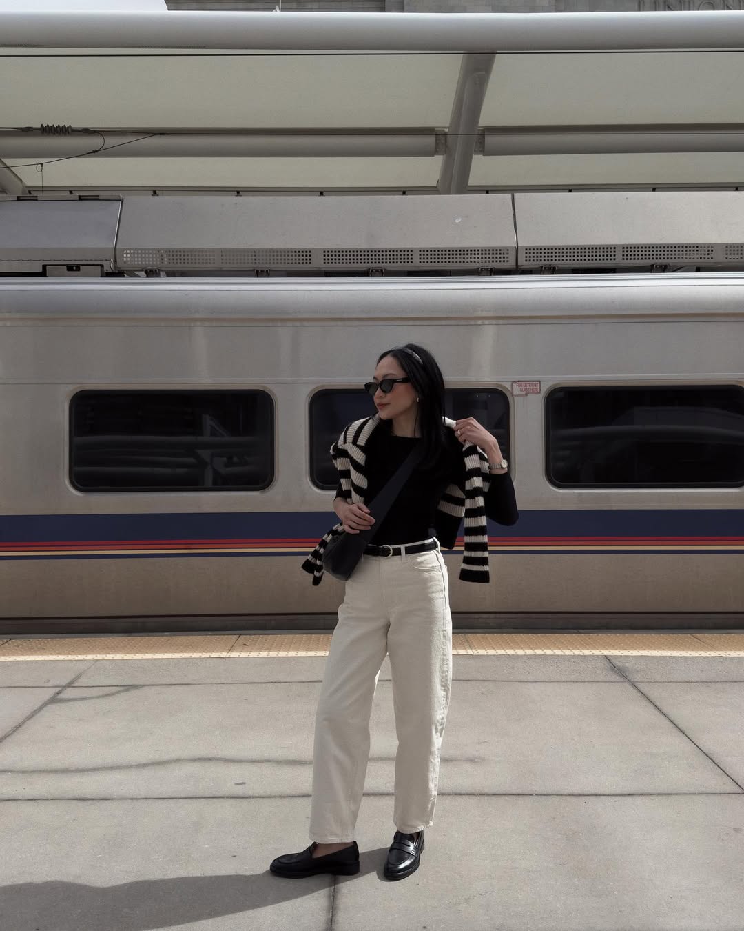 @dawn.tan wear a pair of cream jeans with a black T-shirt and a striped jumper