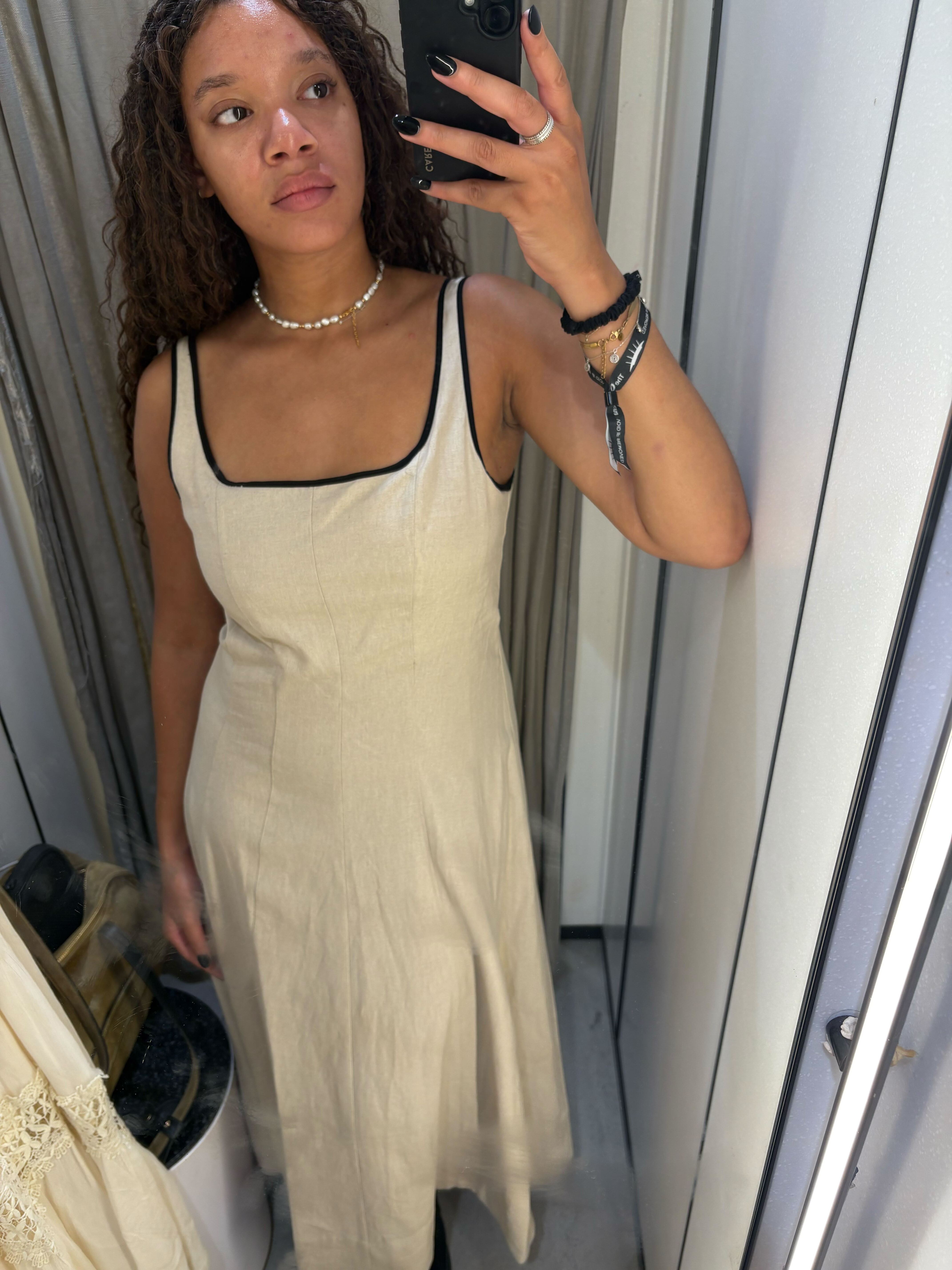 Imani wears the Zara linen dress with contrast piping in a recent image taken in store in Zara Oxford Circus.