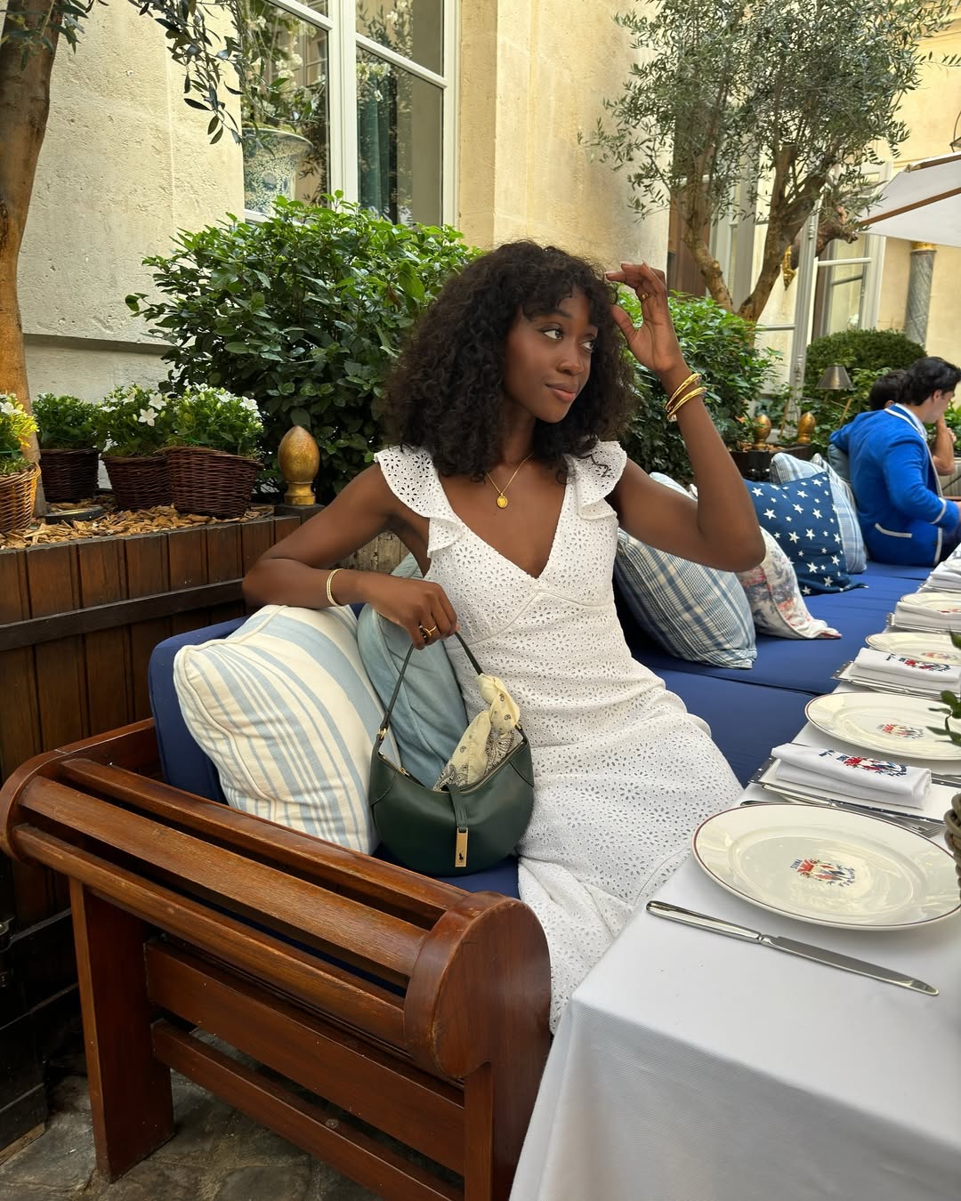 @emmanuellek_ wears a white broderie anglaise dress