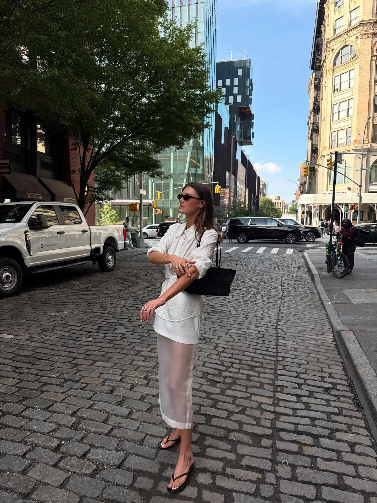 Coco Schiffer wears an all-white summer outfit.